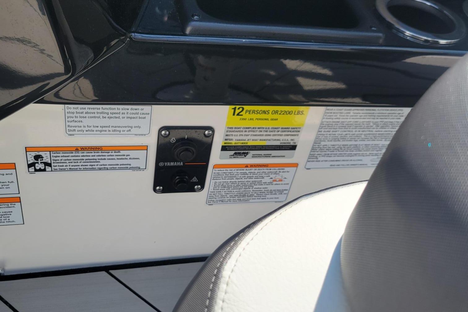 2021 Yamaha Boats 252XE capacity and warning labels on boat interior.