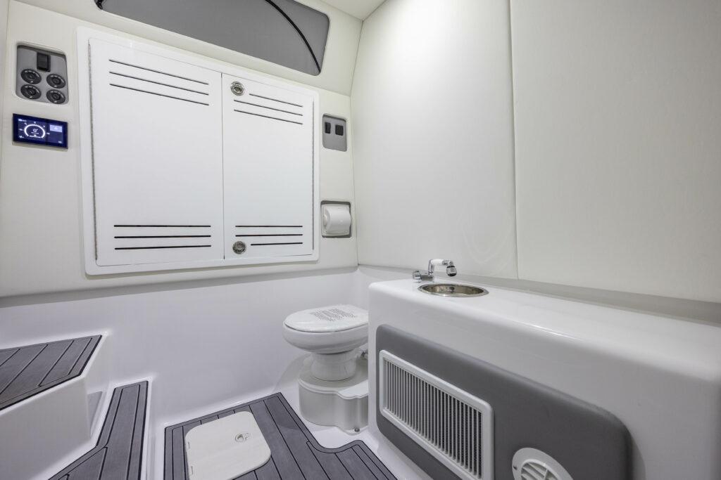 Front Runner-39 CC Custom 2026 -FL-US-2024 Front Runner 39 CC Custom boat bathroom with modern fixtures and storage cabinets.-9053590 | Thumbnail