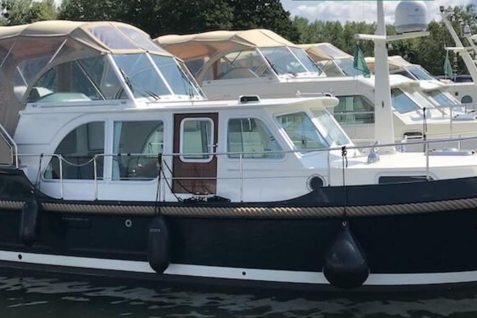 2014 Linssen Yachts The New Classic Sturdy 36 AC docked, showcasing elegant design.