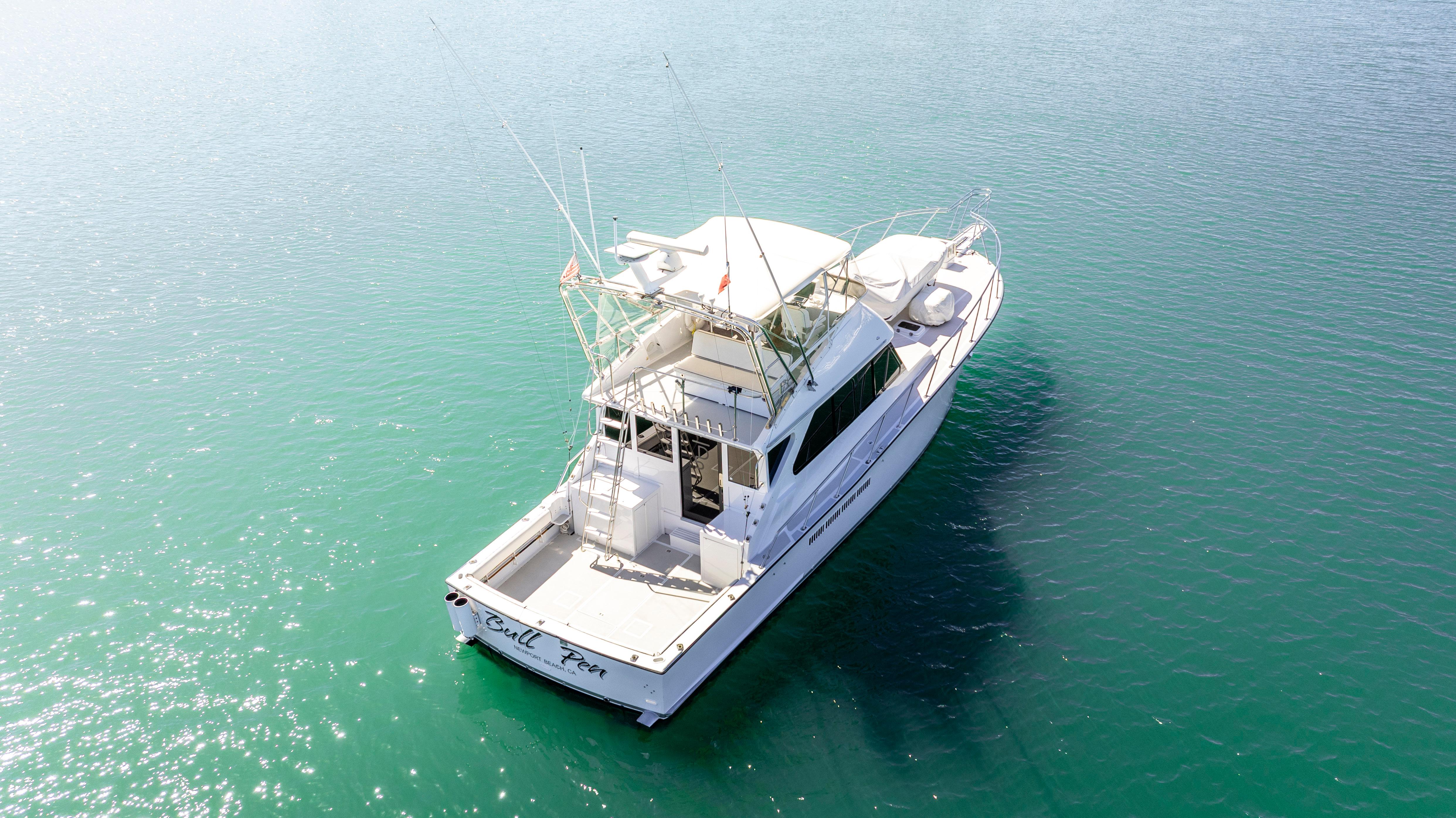 Pacifica-50 Convertible 1983-Bull Pen CA-US-1983 Pacifica 50 Convertible boat on clear blue water, aerial view.-9793604 | Thumbnail