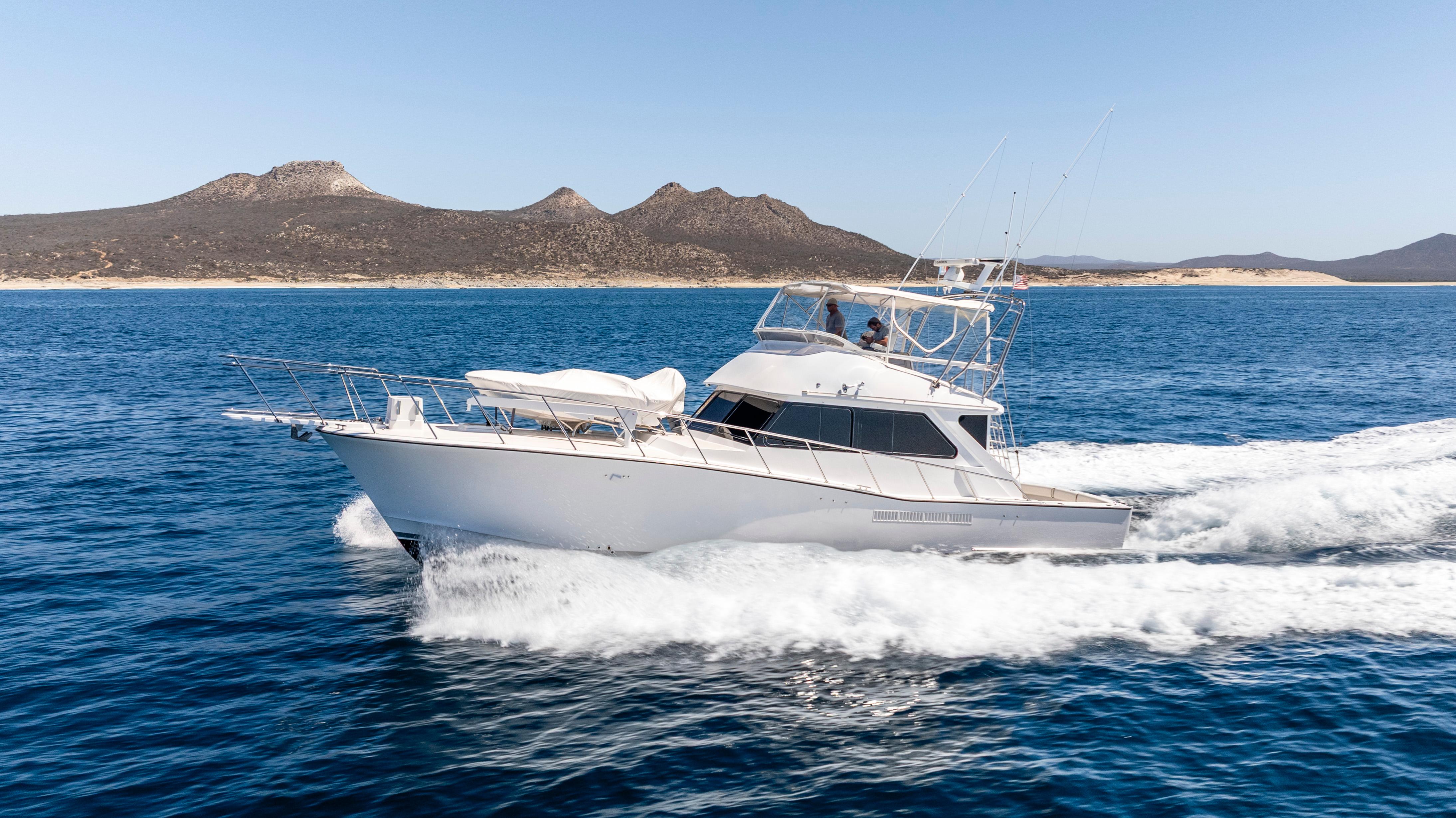 Pacifica-50 Convertible 1983-Bull Pen CA-US-1983 Pacifica 50 Convertible yacht cruising on open sea with scenic mountain backdrop.-9793604