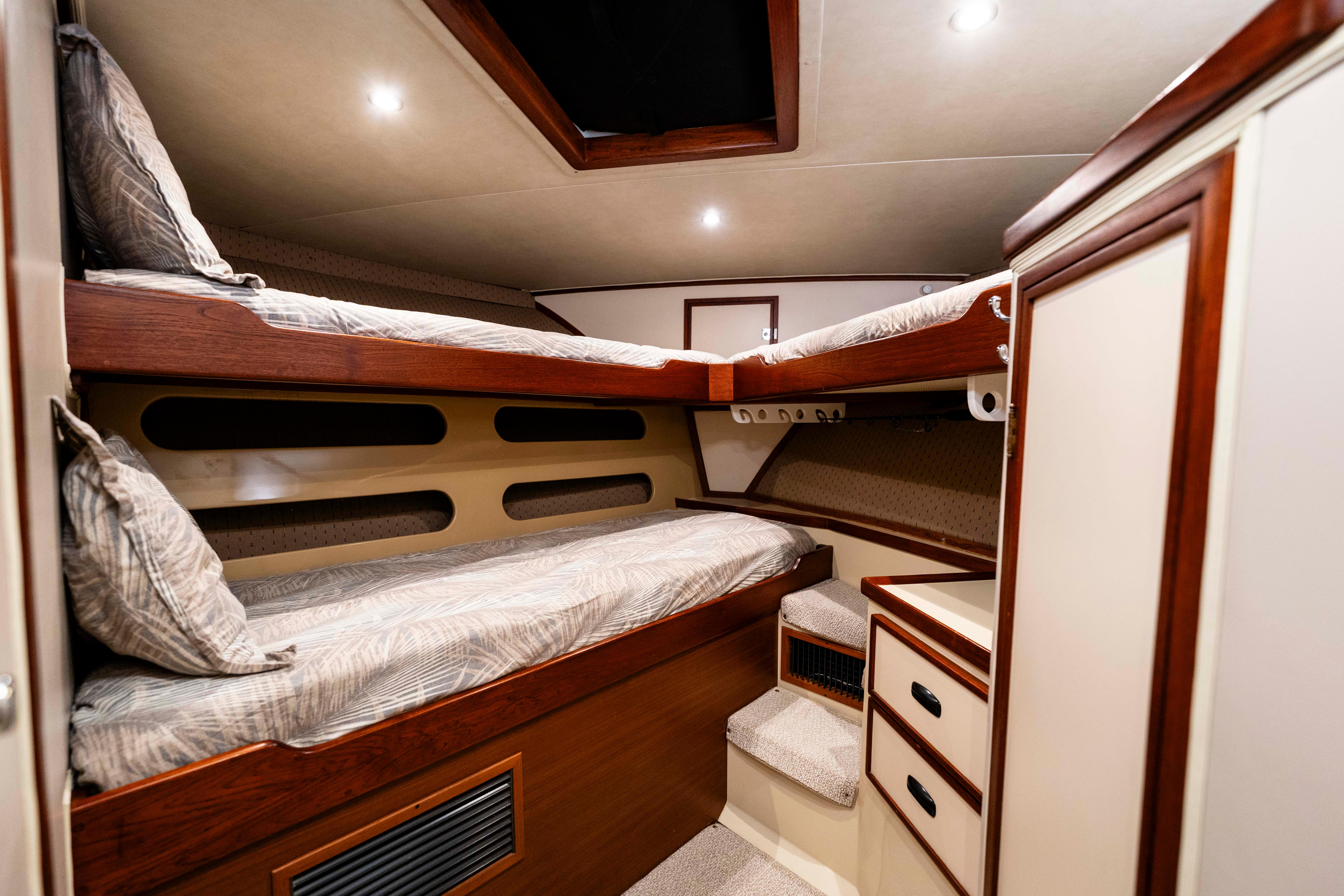 Pacifica-50 Convertible 1983-Bull Pen CA-US-1983 Pacifica 50 Convertible yacht interior with cozy bunk beds and wooden accents.-9793604 | Thumbnail
