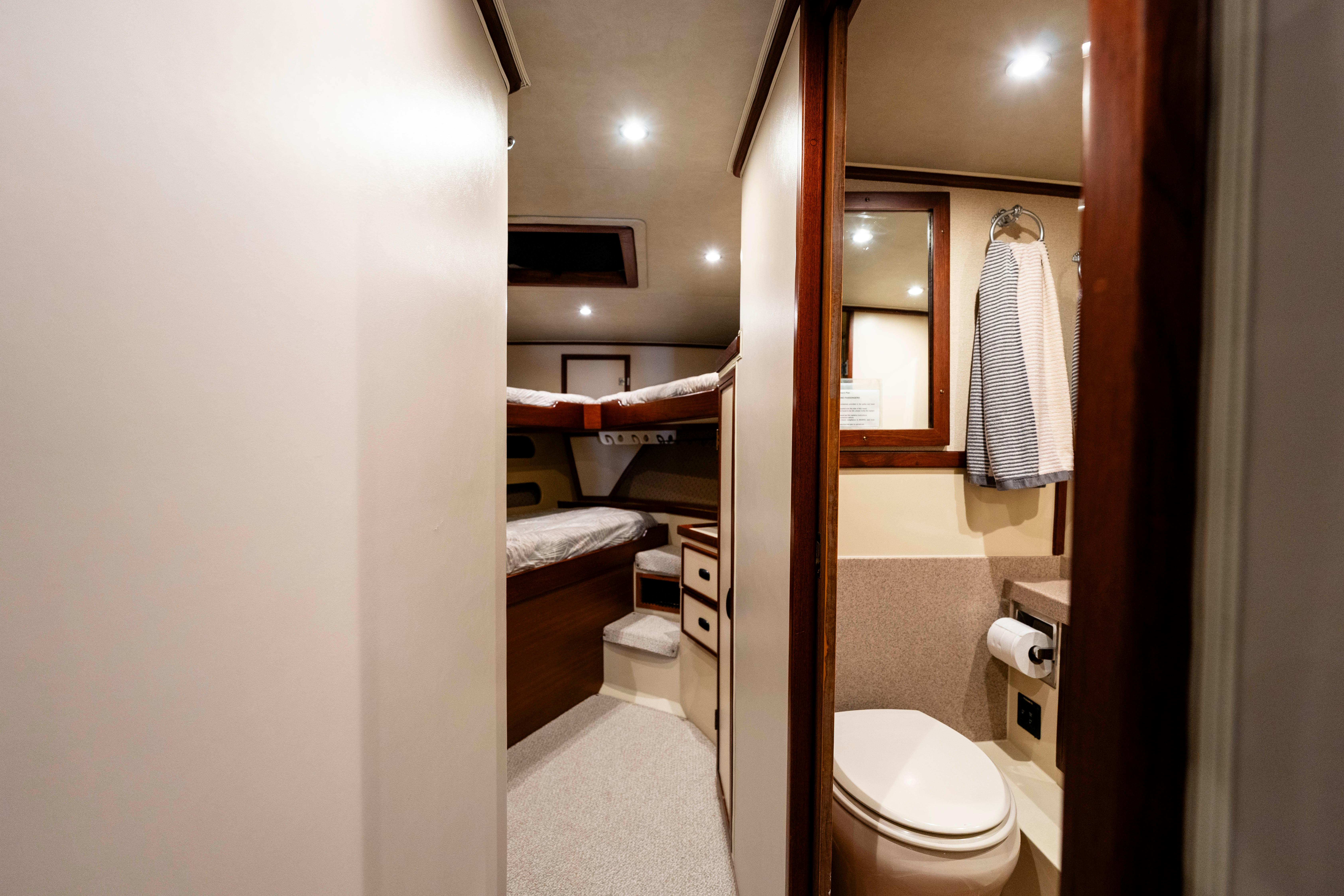 Pacifica-50 Convertible 1983-Bull Pen CA-US-Interior of 1983 Pacifica 50 Convertible yacht, featuring cozy cabin and bathroom.-9793604 | Thumbnail