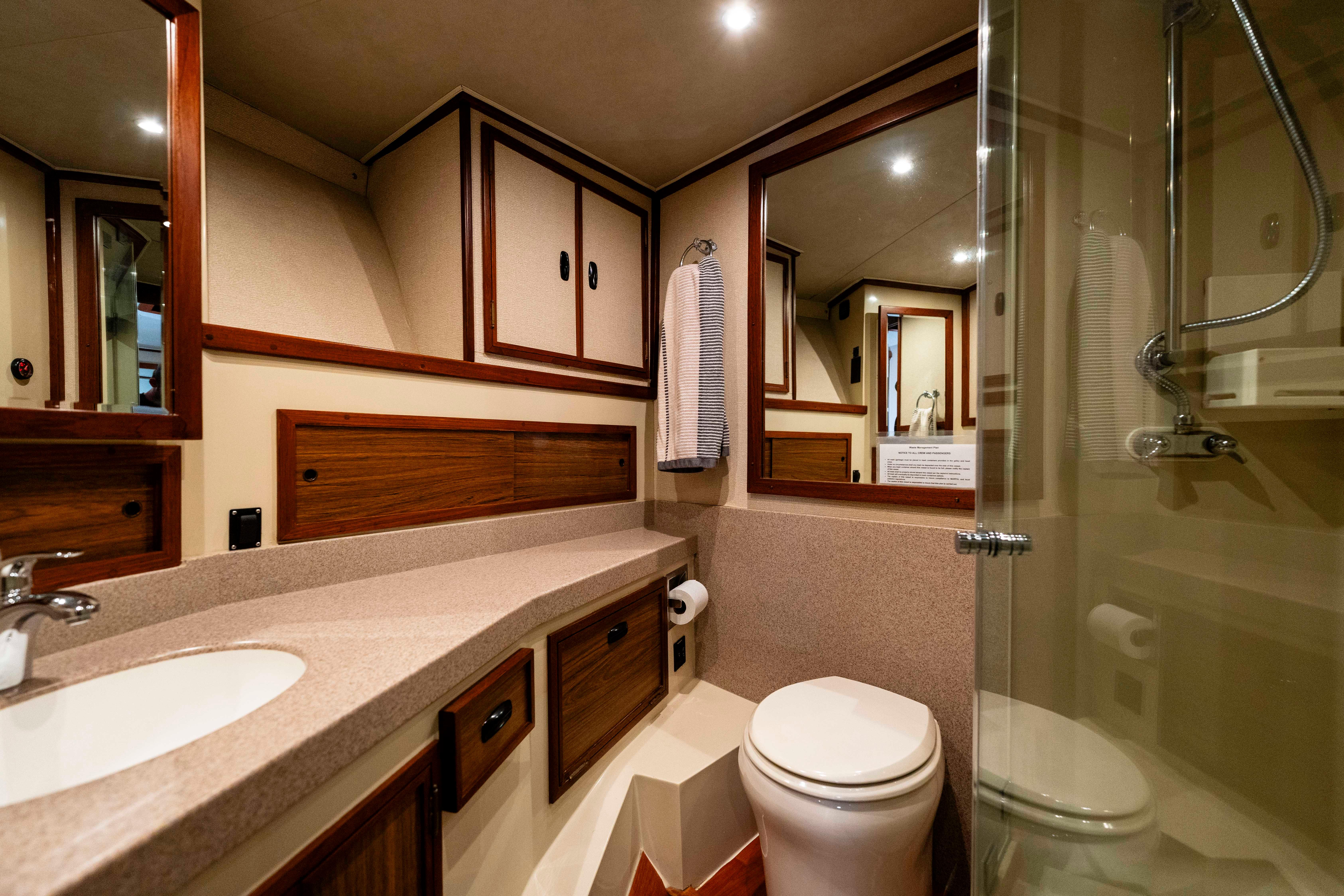 Pacifica-50 Convertible 1983-Bull Pen CA-US-Luxurious bathroom in 1983 Pacifica 50 Convertible yacht with modern fixtures and wood accents.-9793604 | Thumbnail