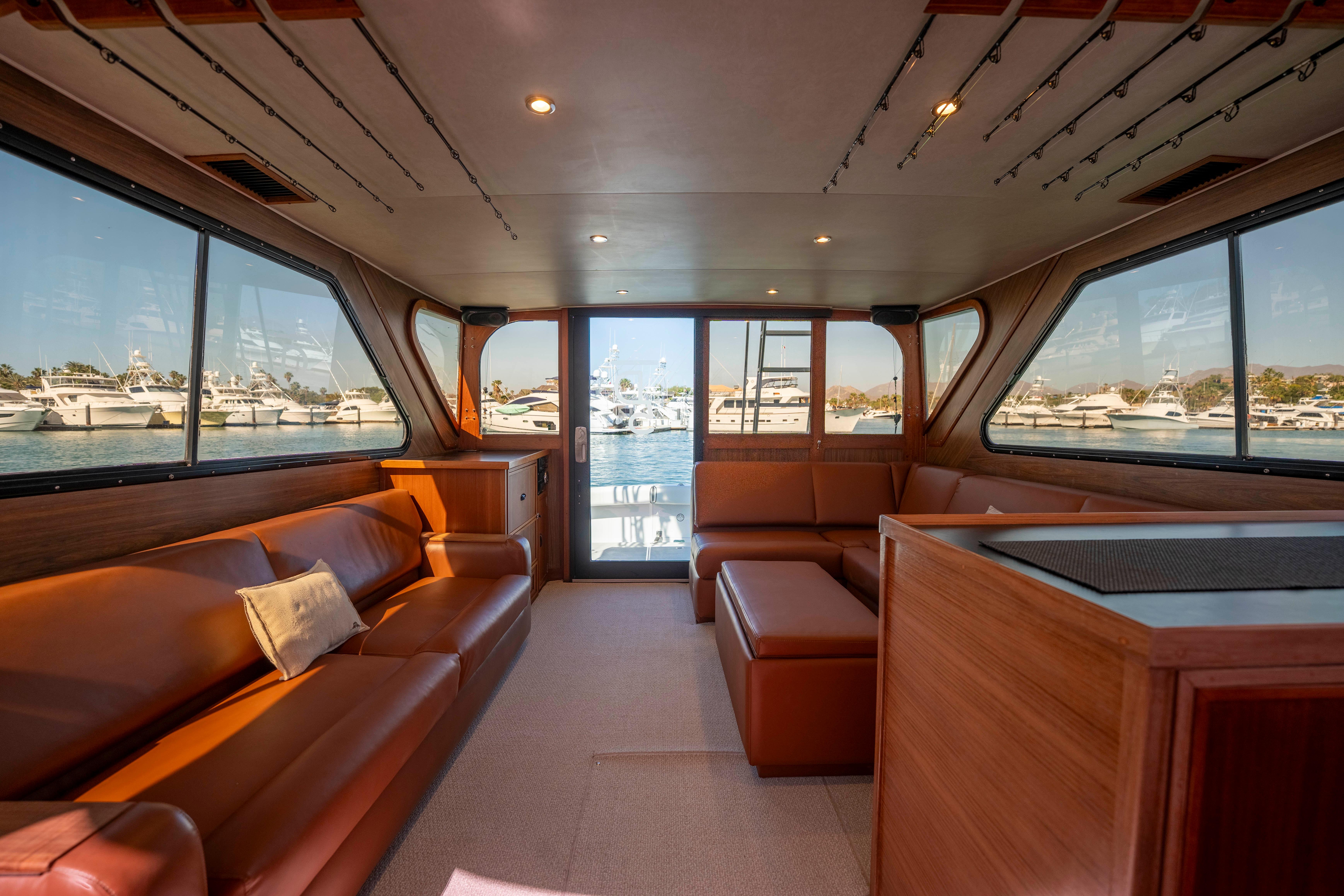 Pacifica-50 Convertible 1983-Bull Pen CA-US-Luxurious interior of 1983 Pacifica 50 Convertible yacht with leather seating and panoramic windows.-9793604 | Thumbnail