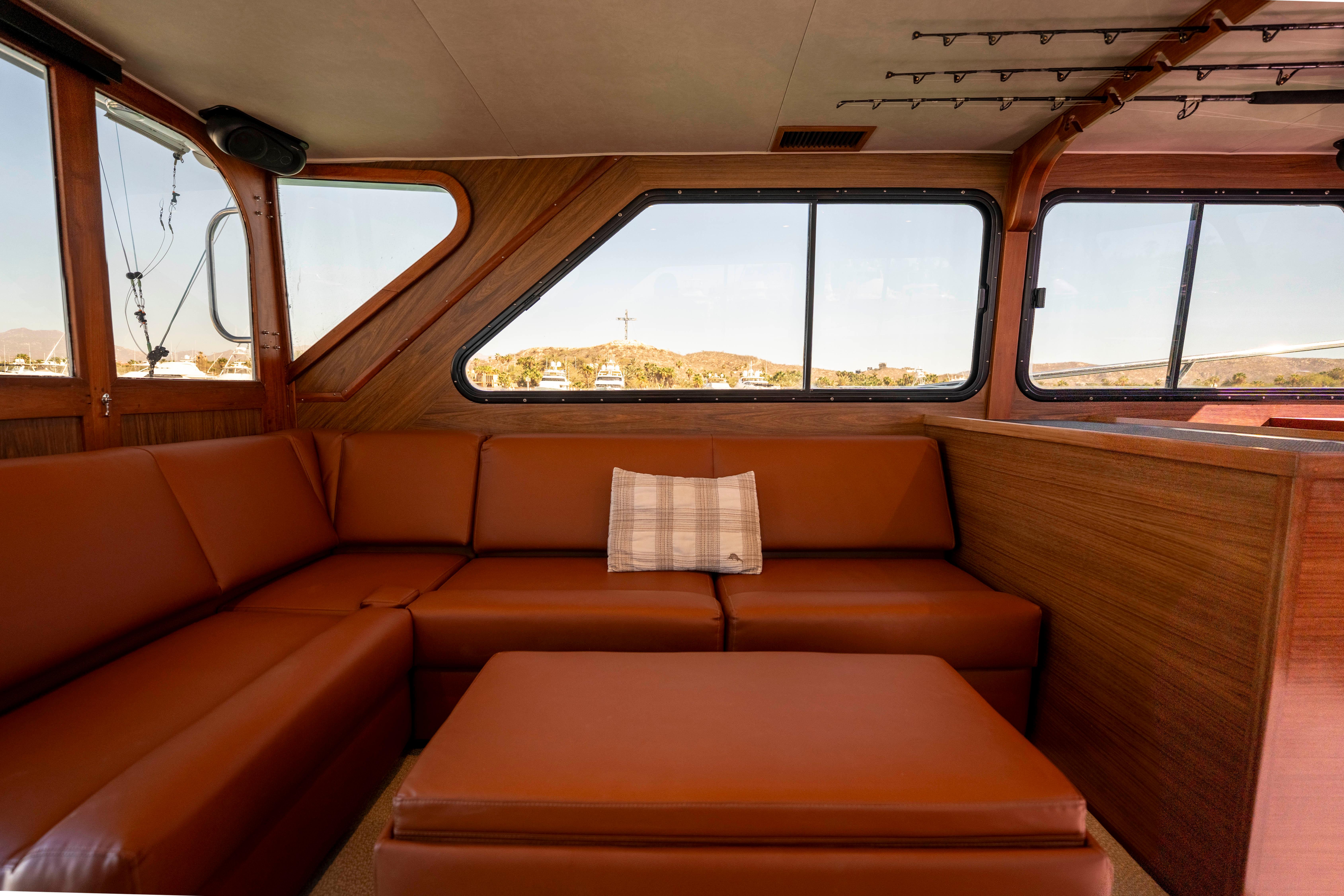 Pacifica-50 Convertible 1983-Bull Pen CA-US-Interior of 1983 Pacifica 50 Convertible yacht with brown leather seating and large windows.-9793604 | Thumbnail