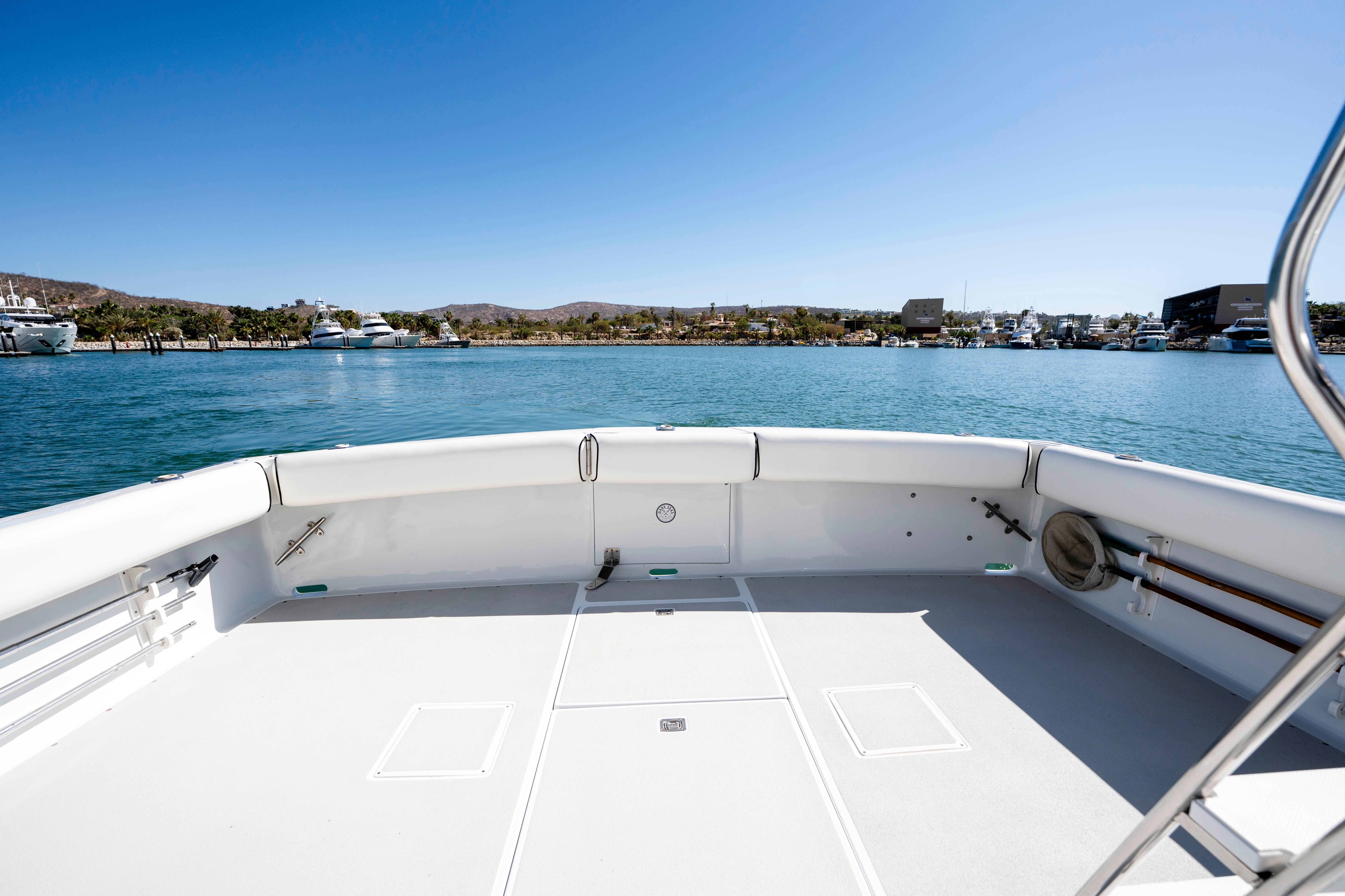 Pacifica-50 Convertible 1983-Bull Pen CA-US-1983 Pacifica 50 Convertible boat deck with ocean view and clear blue sky.-9793604 | Thumbnail