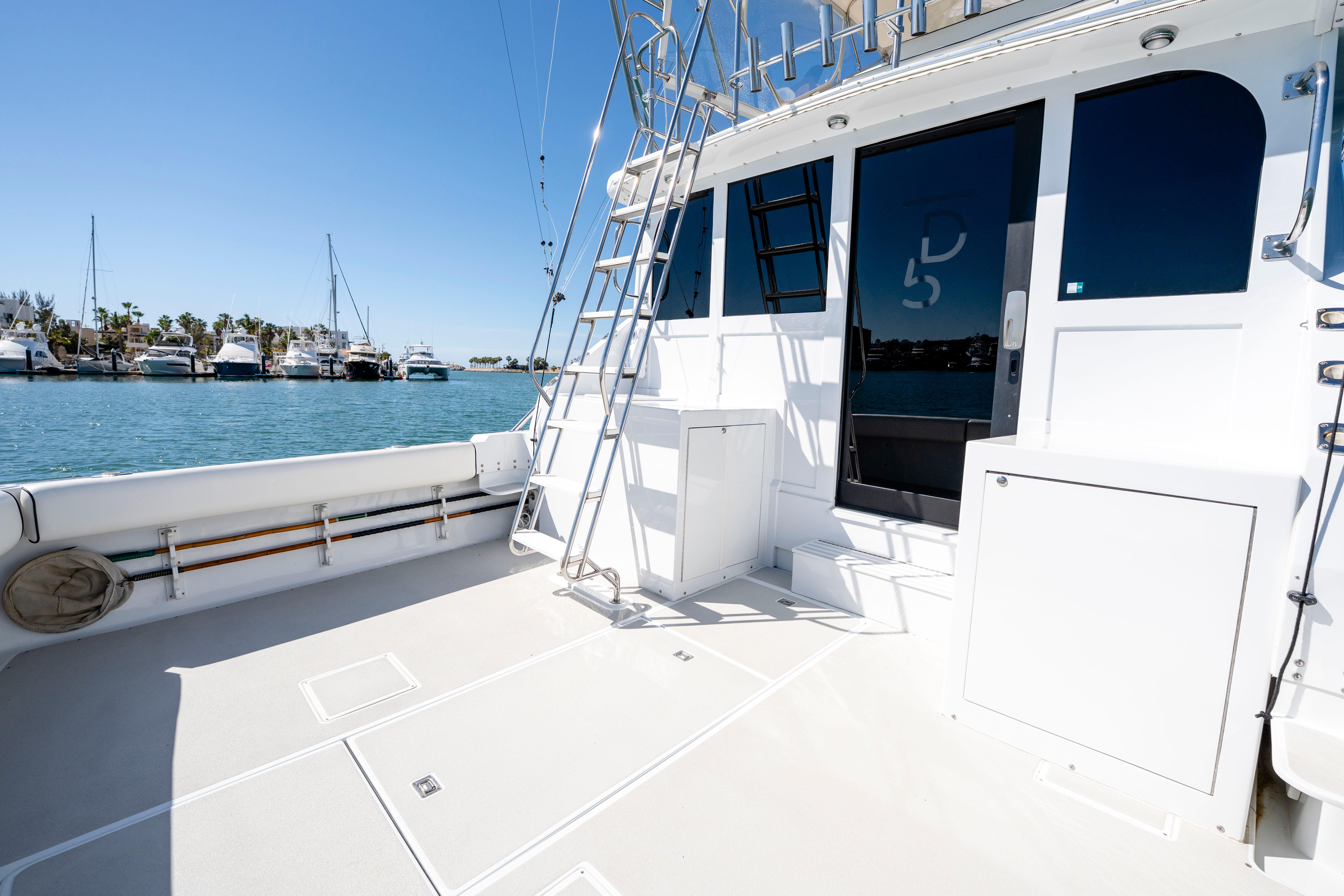 Pacifica-50 Convertible 1983-Bull Pen CA-US-1983 Pacifica 50 Convertible yacht deck with ladder, docked by calm waters.-9793604 | Thumbnail