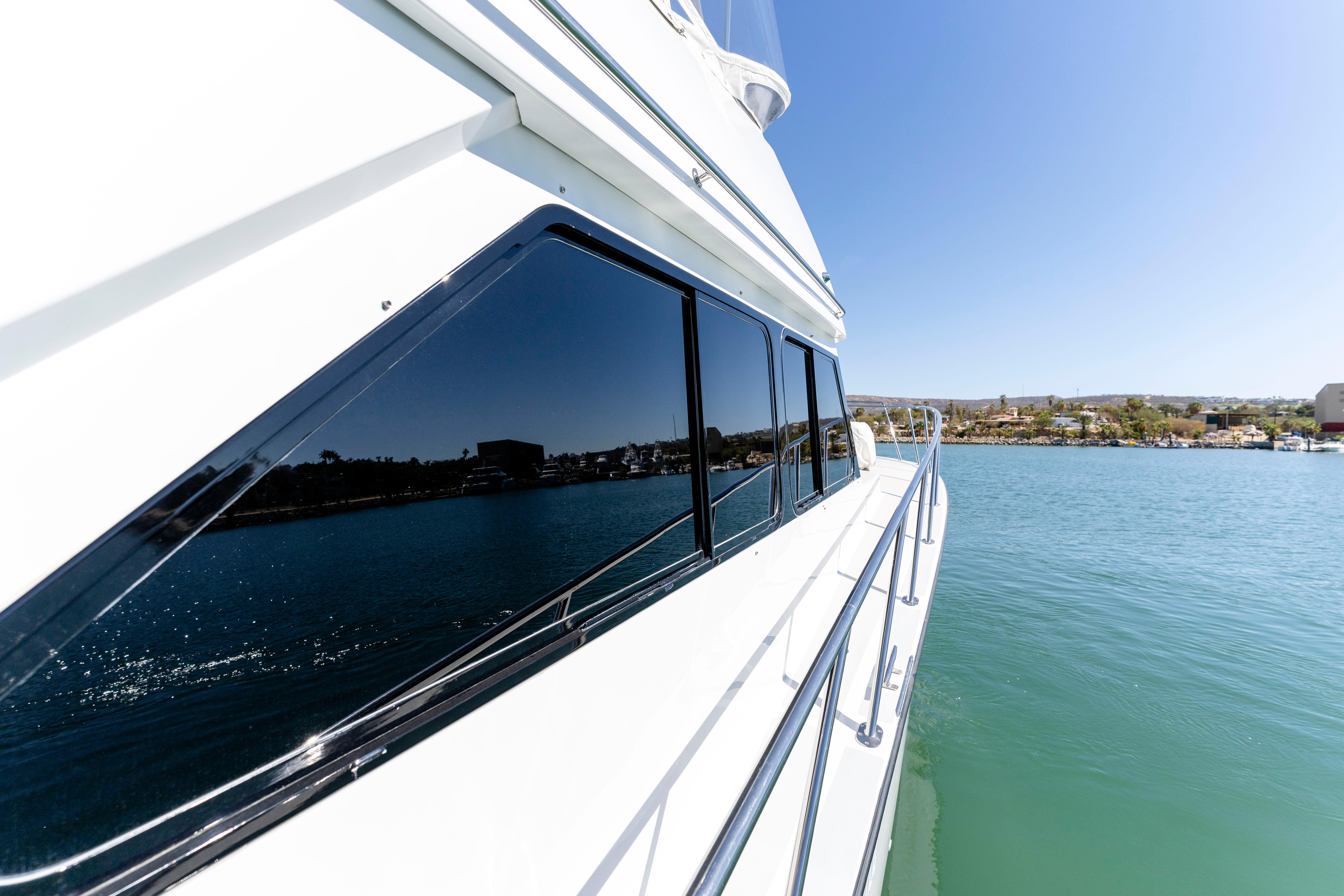 Pacifica-50 Convertible 1983-Bull Pen CA-US-1983 Pacifica 50 Convertible yacht on calm water, reflecting clear blue sky.-9793604 | Thumbnail