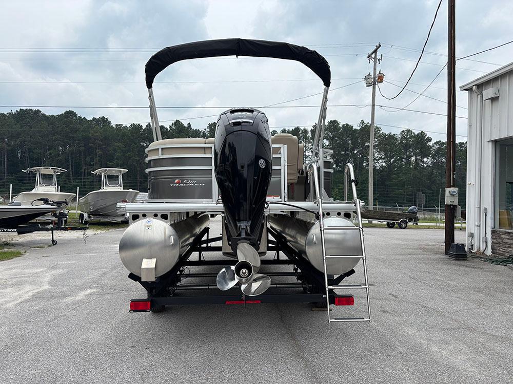 2025 Sun Tracker Party Barge 20 DLX pontoon boat, rear view with motor and ladder.
