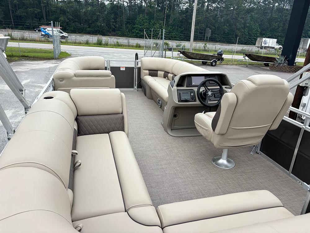 2025 Sun Tracker Party Barge 20 DLX with spacious seating and modern helm.