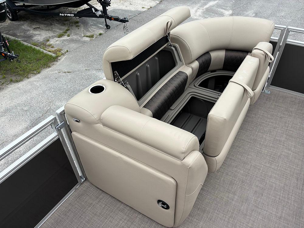 2025 Sun Tracker Party Barge 20 DLX with luxurious seating and storage compartments.