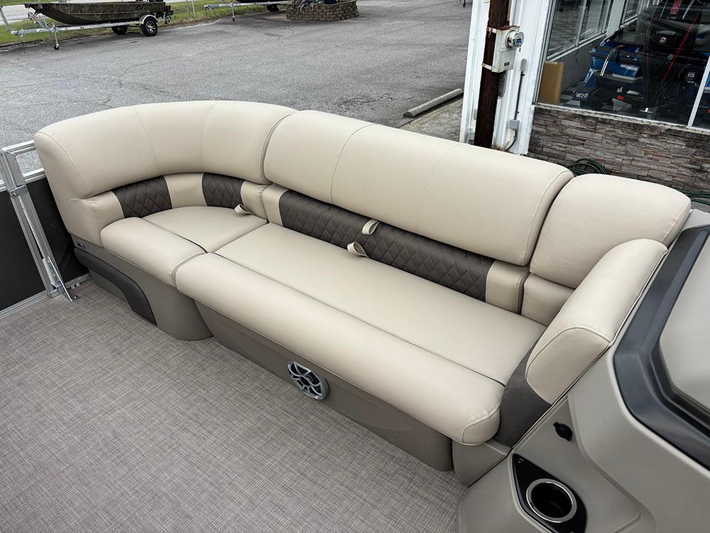 2025 Sun Tracker Party Barge 20 DLX, beige seating, outdoor setting.