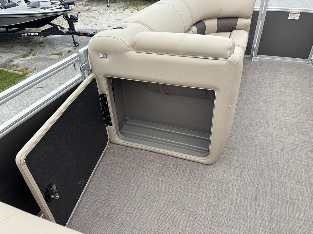 2025 Sun Tracker Party Barge 20 DLX pontoon boat with open storage compartment.