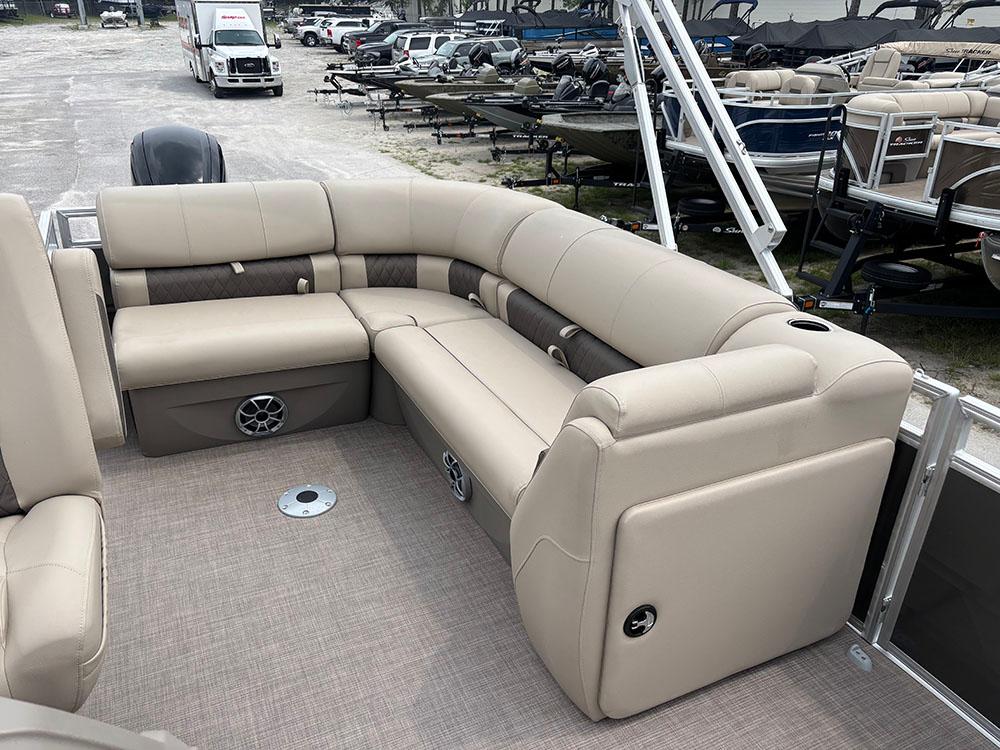 2025 Sun Tracker Party Barge 20 DLX with beige seating, spacious layout, and modern design.