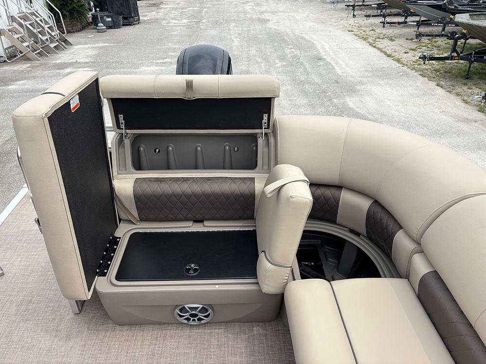 2025 Sun Tracker Party Barge 20 DLX interior seating with storage compartments open.