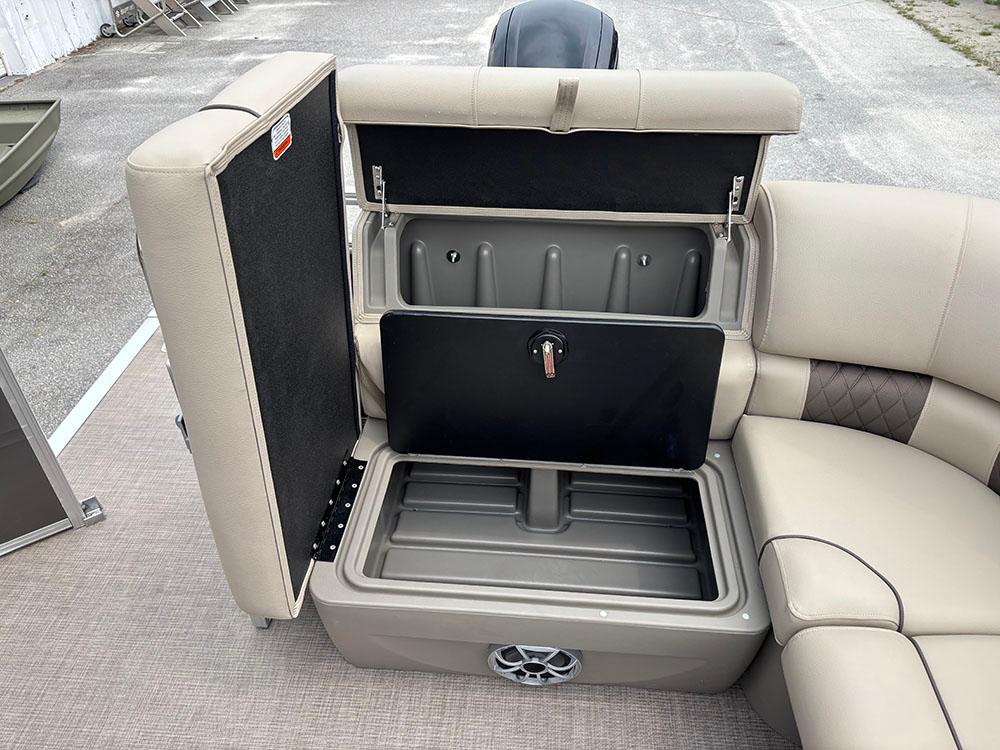 2025 Sun Tracker Party Barge 20 DLX storage compartment with open lid, showcasing spacious interior.