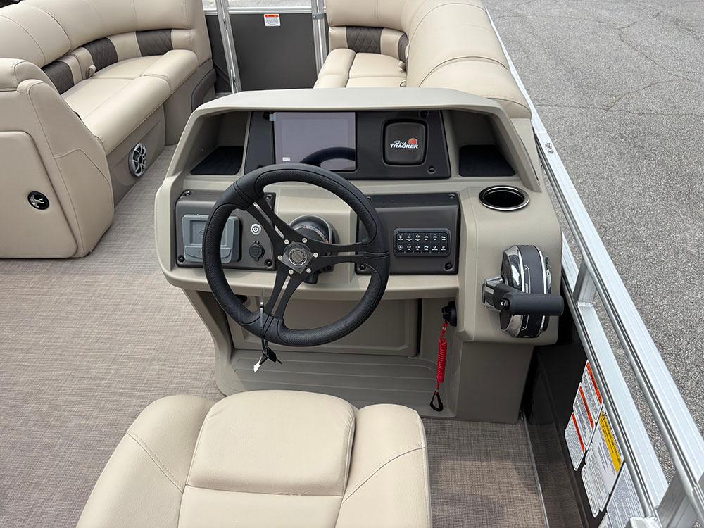 2025 Sun Tracker Party Barge 20 DLX interior with steering console and seating.