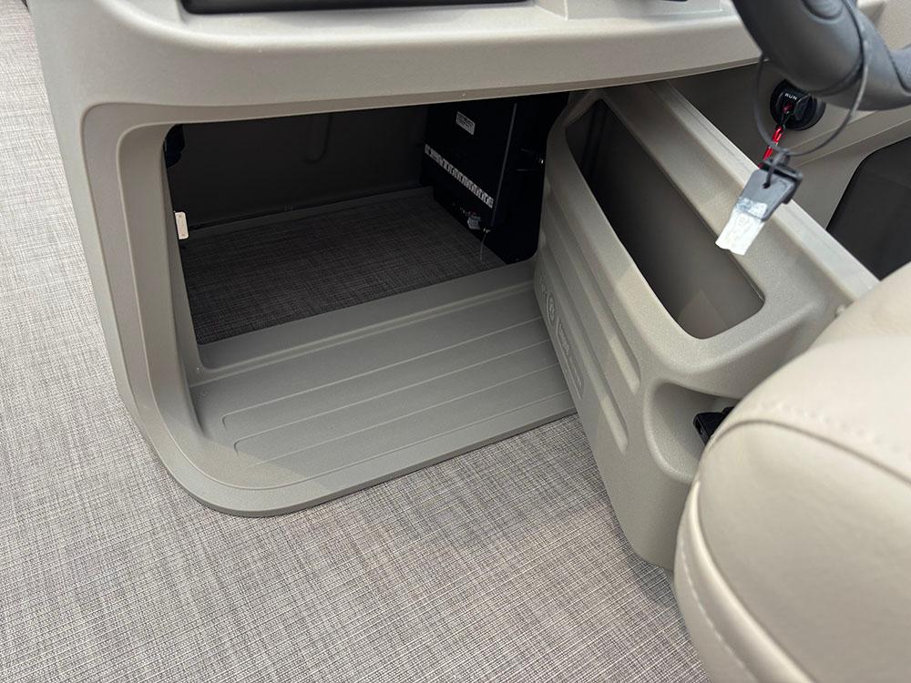 2025 Sun Tracker Party Barge 20 DLX interior console with key and storage compartment.