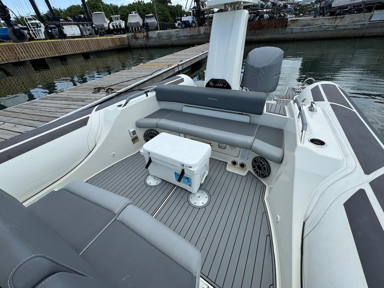 Brig-Eagle 10 2022 -FL-US-2022 Brig Eagle 10 boat interior at dock, featuring seating and cooler.-9423654 | Thumbnail