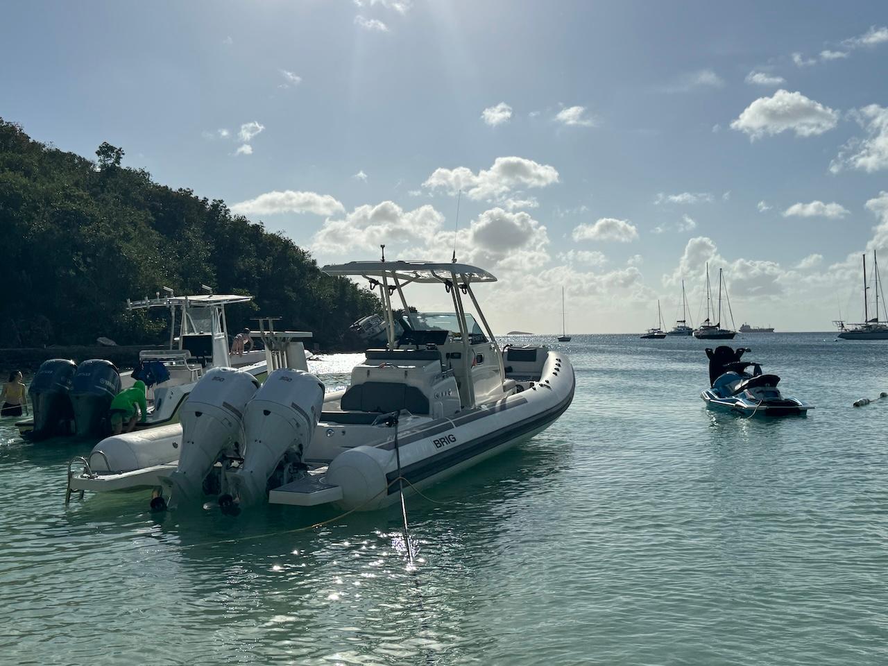 Brig-Eagle 10 2022 -FL-US-2022 Brig Eagle 10 boat anchored in a serene tropical bay with other boats.-9423654 | Thumbnail