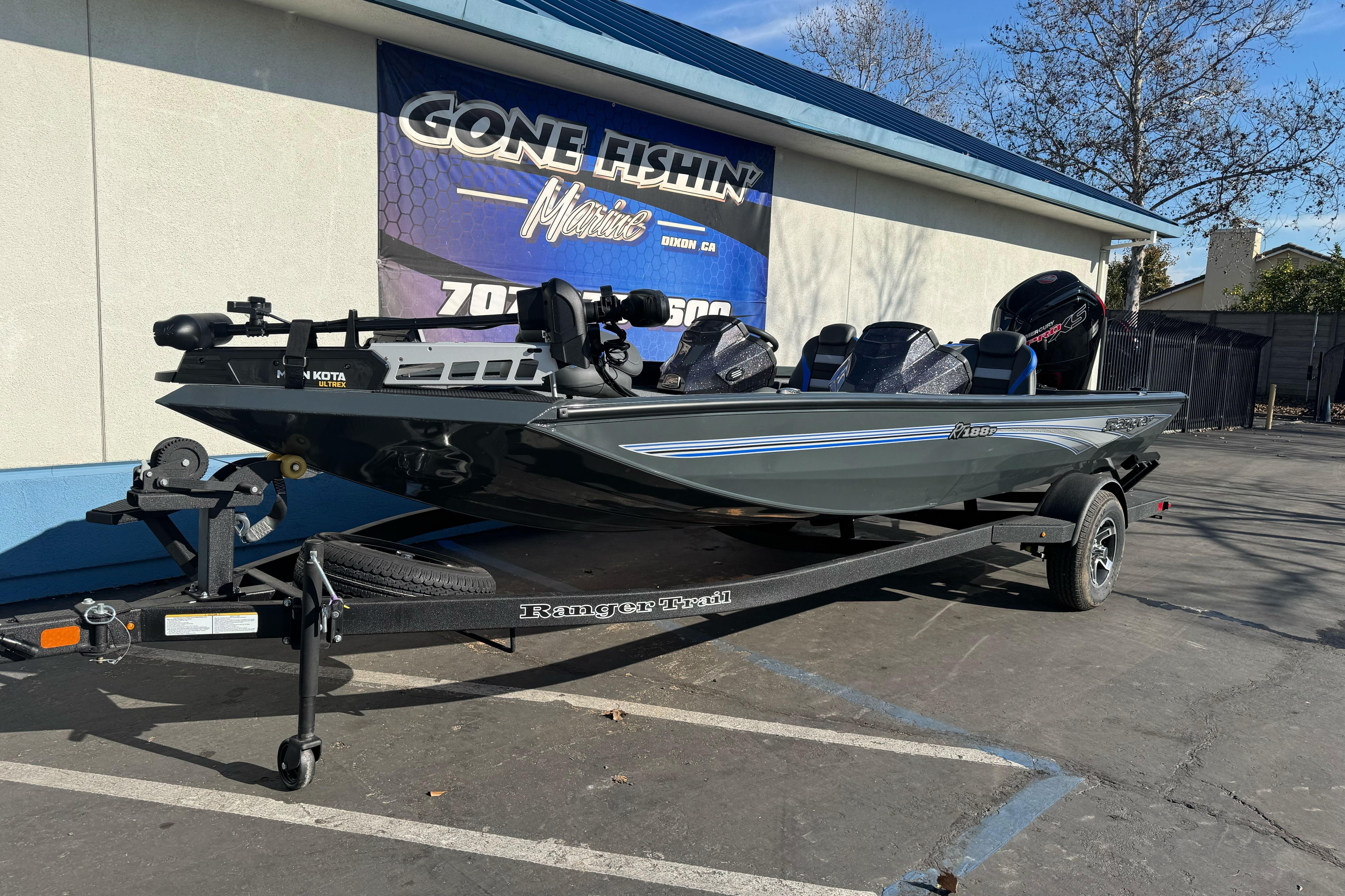 2026 Ranger RT188P fishing boat on trailer outside marine shop.
