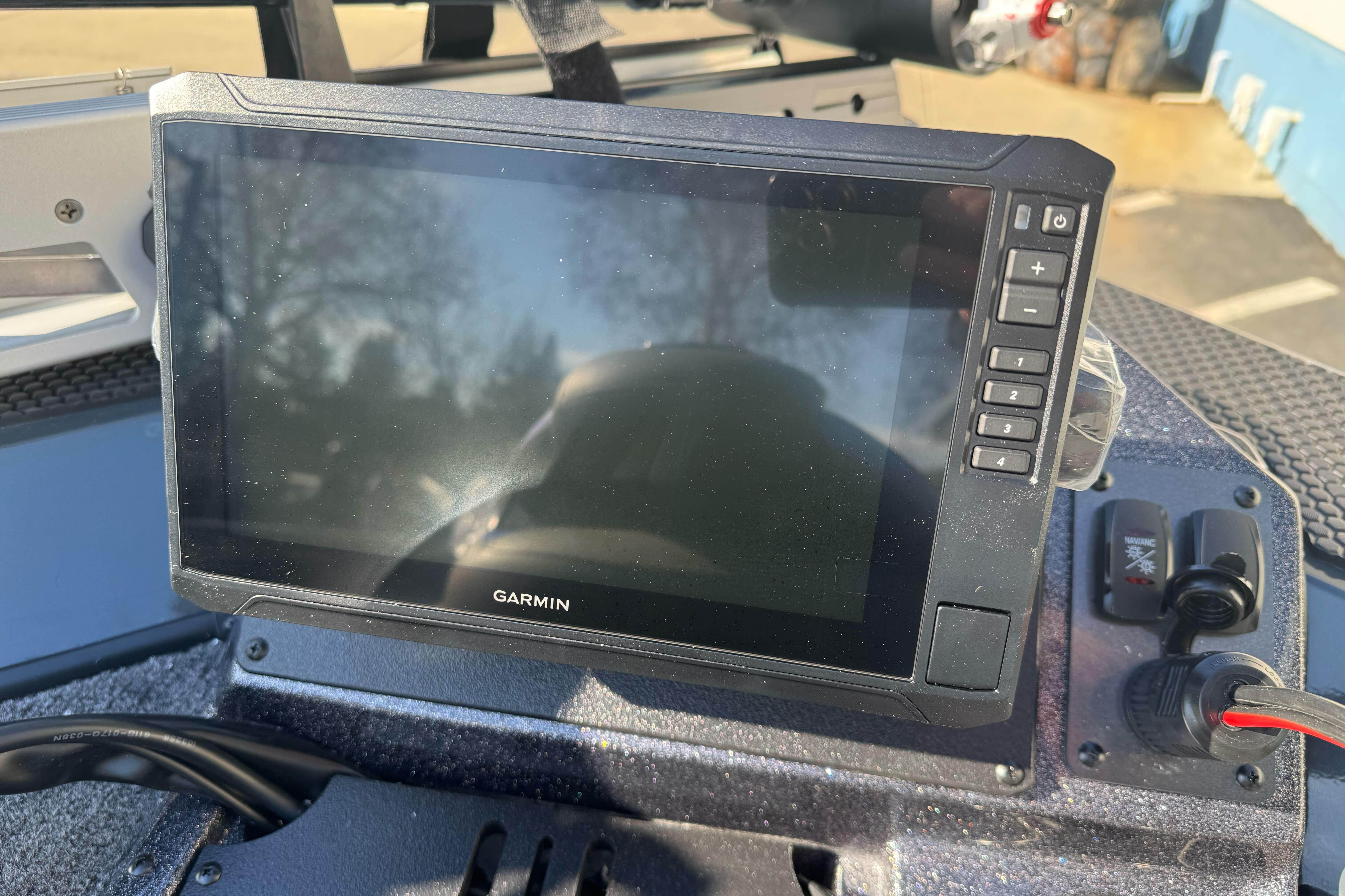 Garmin display on 2026 Ranger RT188P boat dashboard, showing control buttons and wiring.