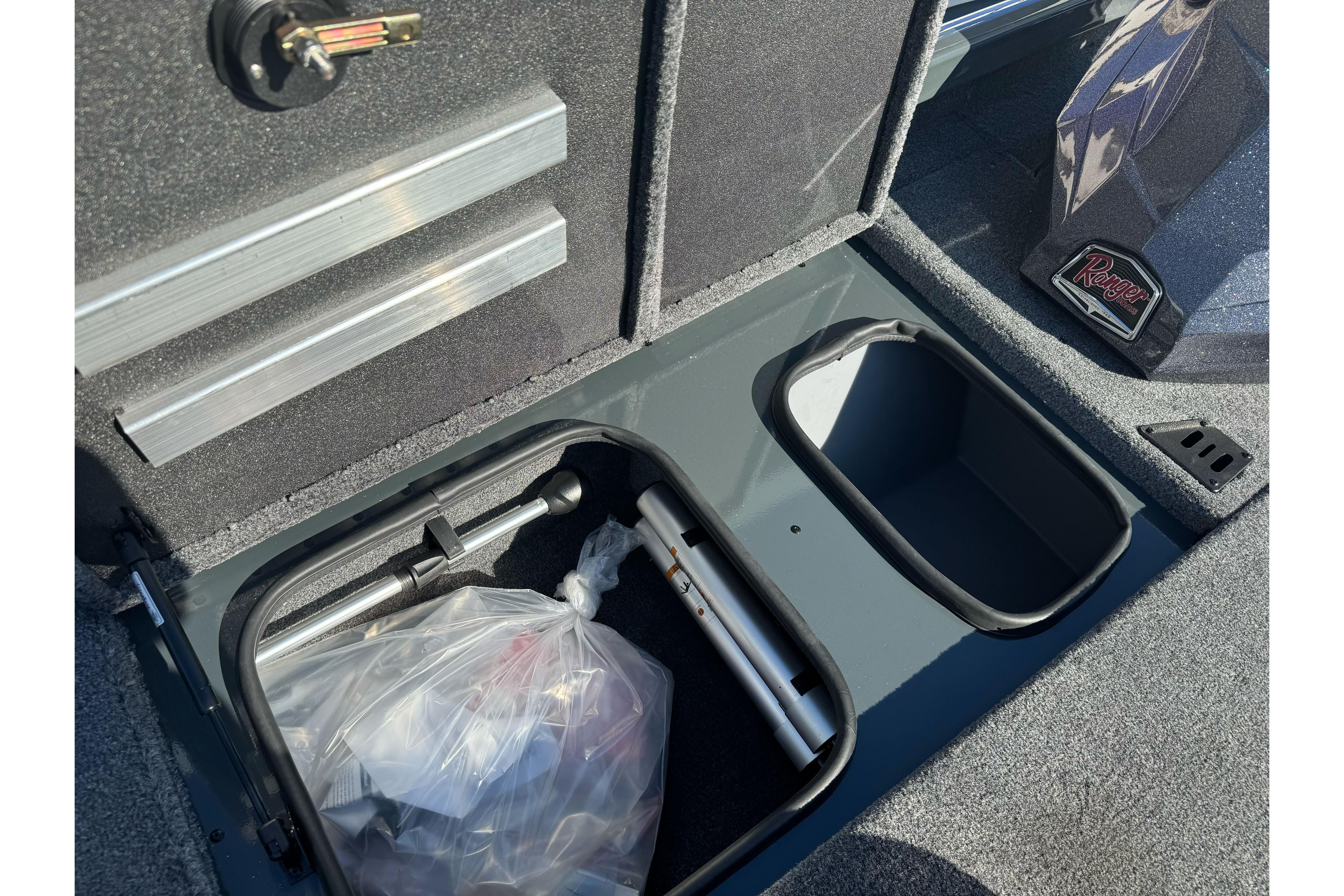 2026 Ranger RT188P boat storage compartment with tools and accessories.