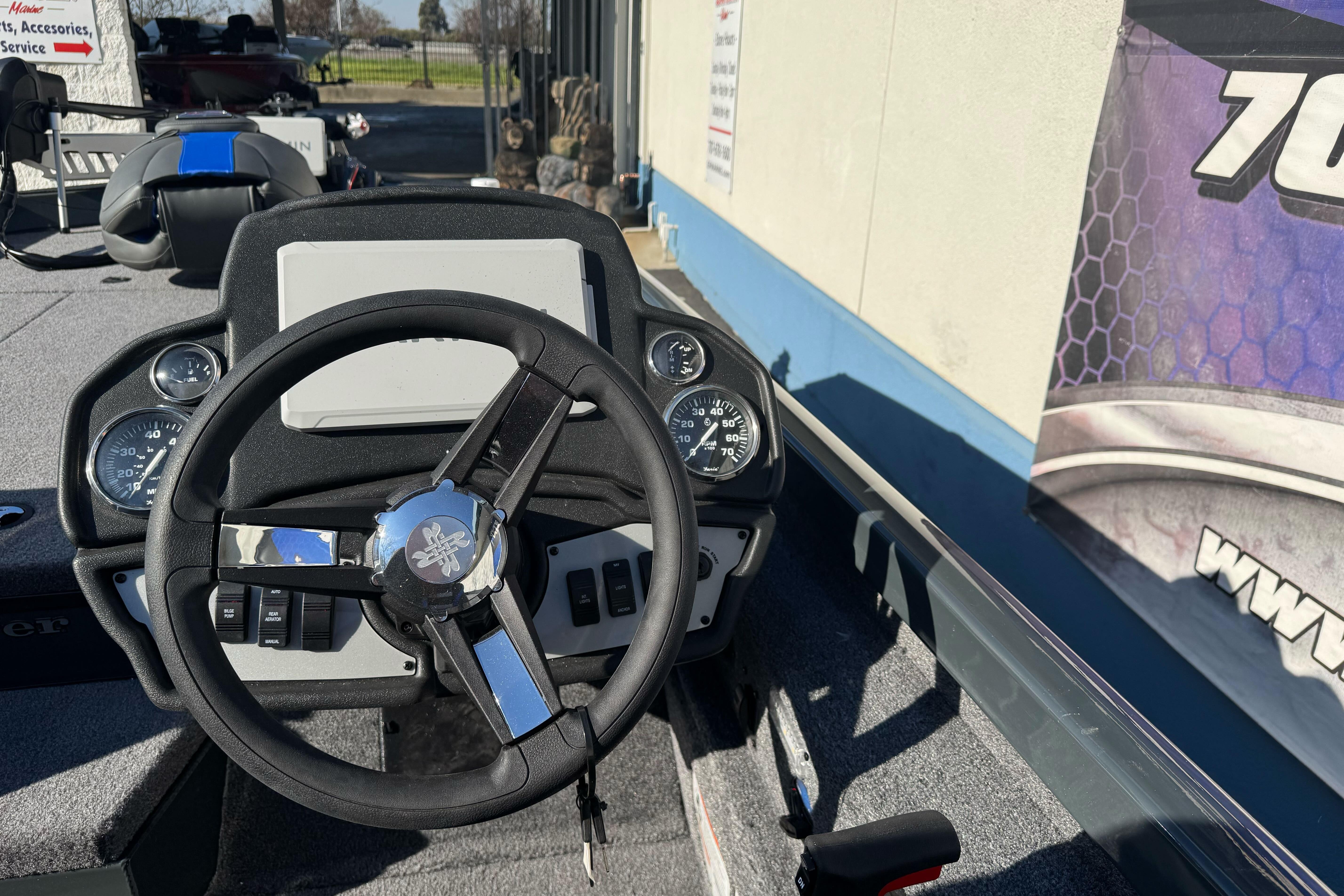 2026 Ranger RT188P boat dashboard with steering wheel and gauges.