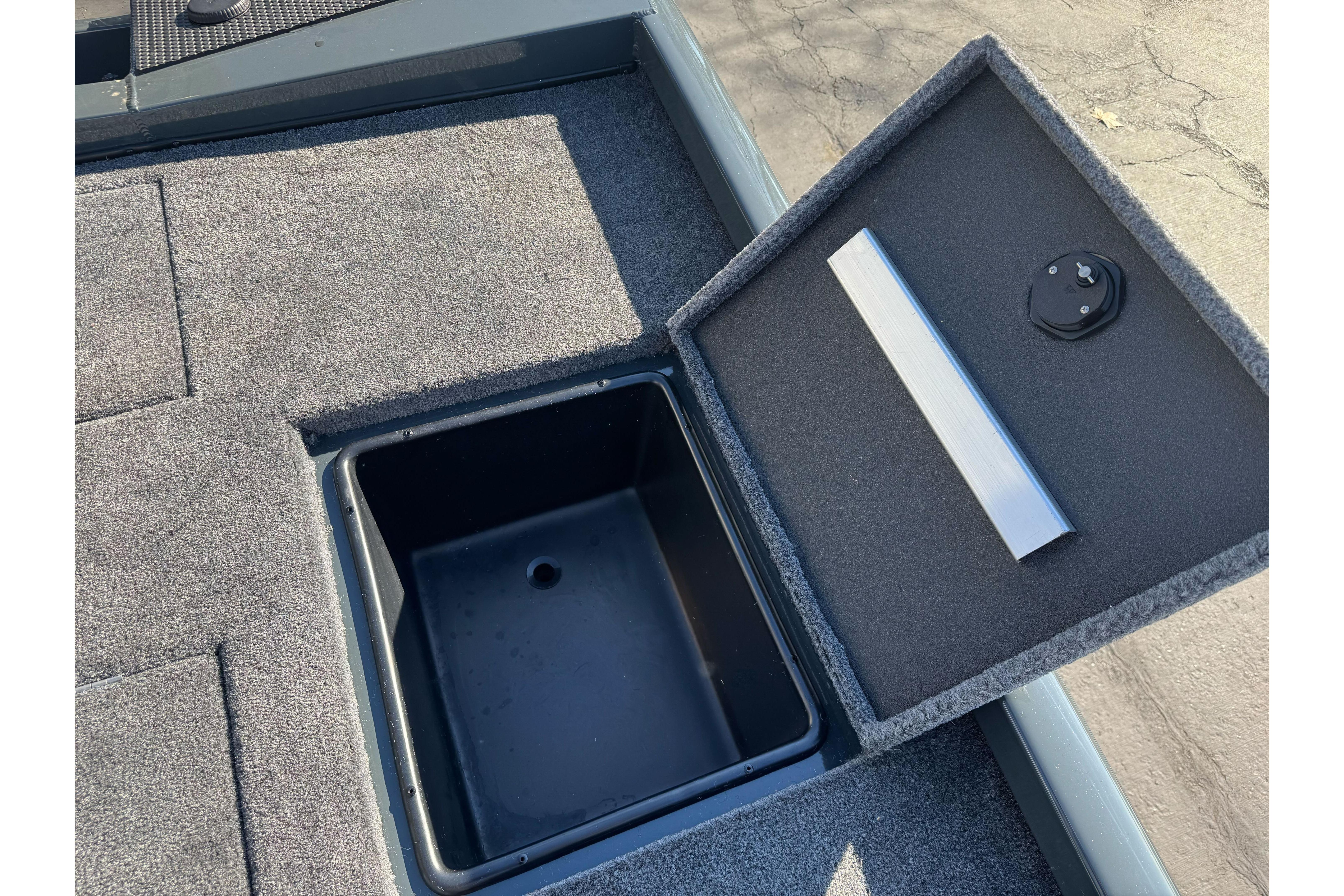 Open storage compartment on 2026 Ranger RT188P boat deck.