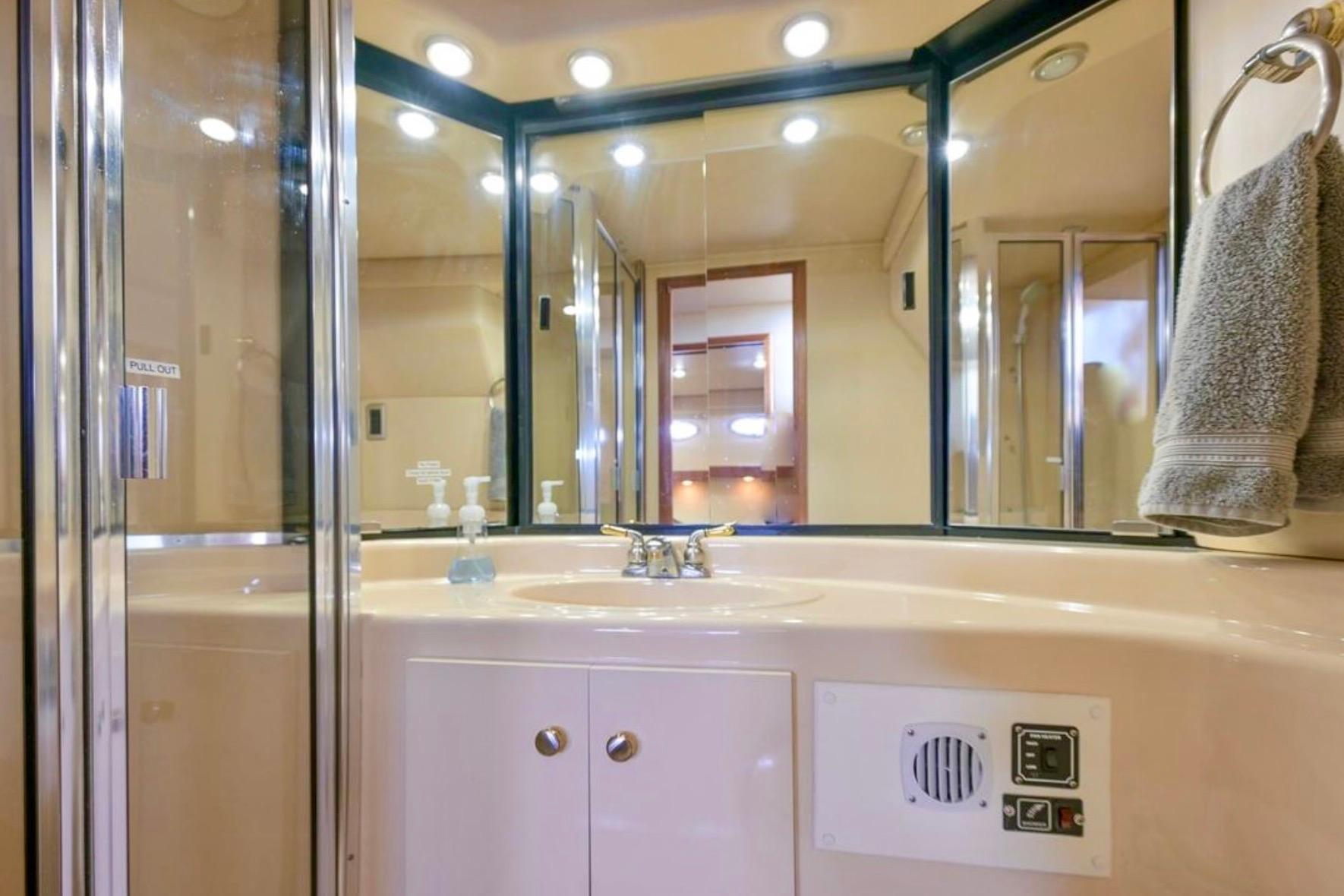 Bathroom interior of 2004 Meridian 490 Pilothouse yacht with modern fixtures and lighting.