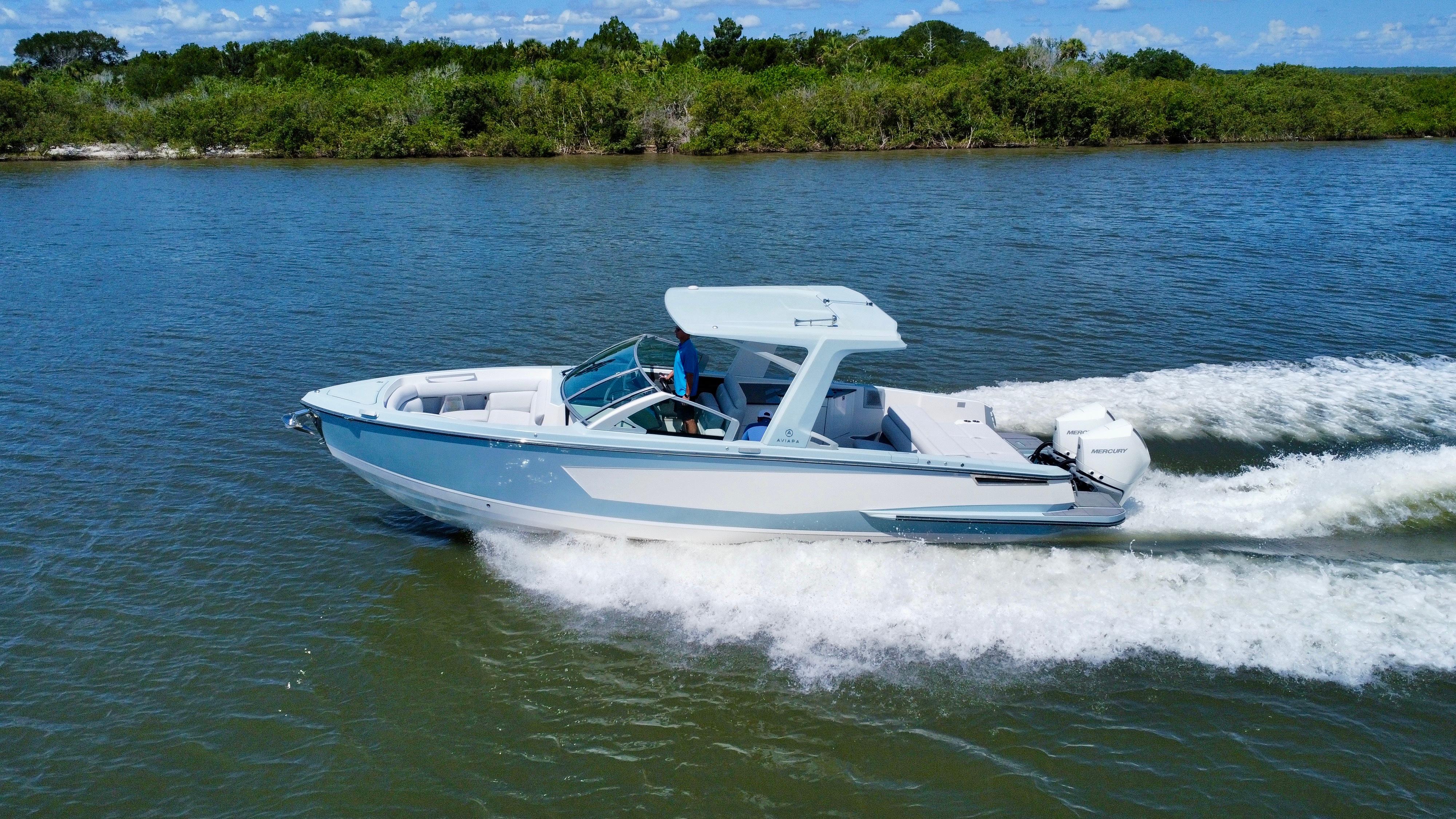 Aviara-AV32 OB 2021 -FL-US-2021 Aviara AV32 OB boat cruising on a scenic waterway.-9443715 | Thumbnail