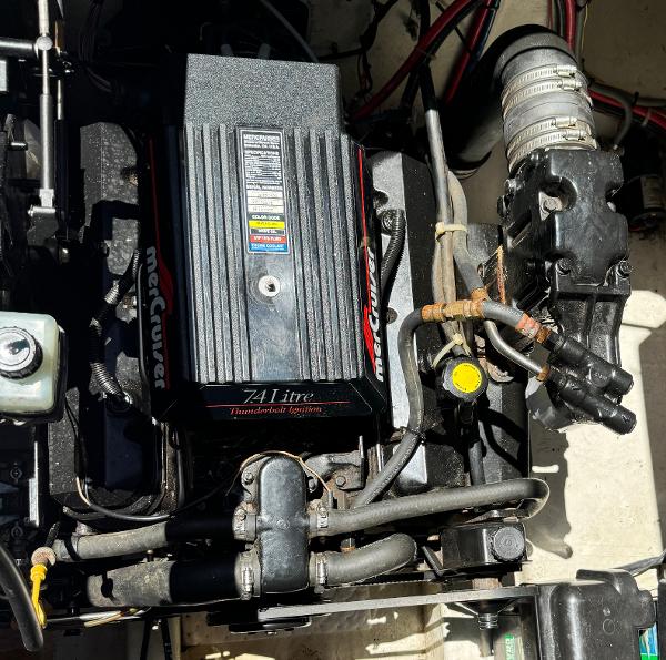 Engine compartment of a 1997 Maxum 3200 SCR with a 7.4L MerCruiser engine.