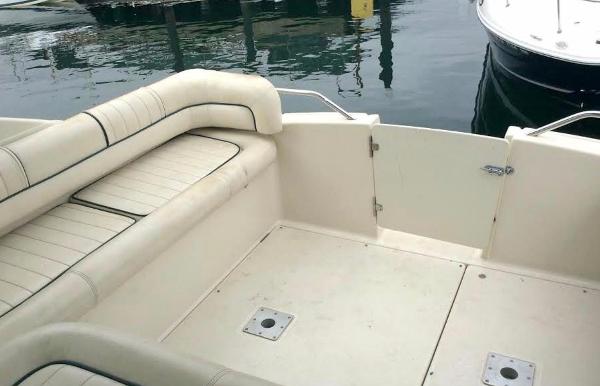 1997 Maxum 3200 SCR boat interior with white seating and open deck area.