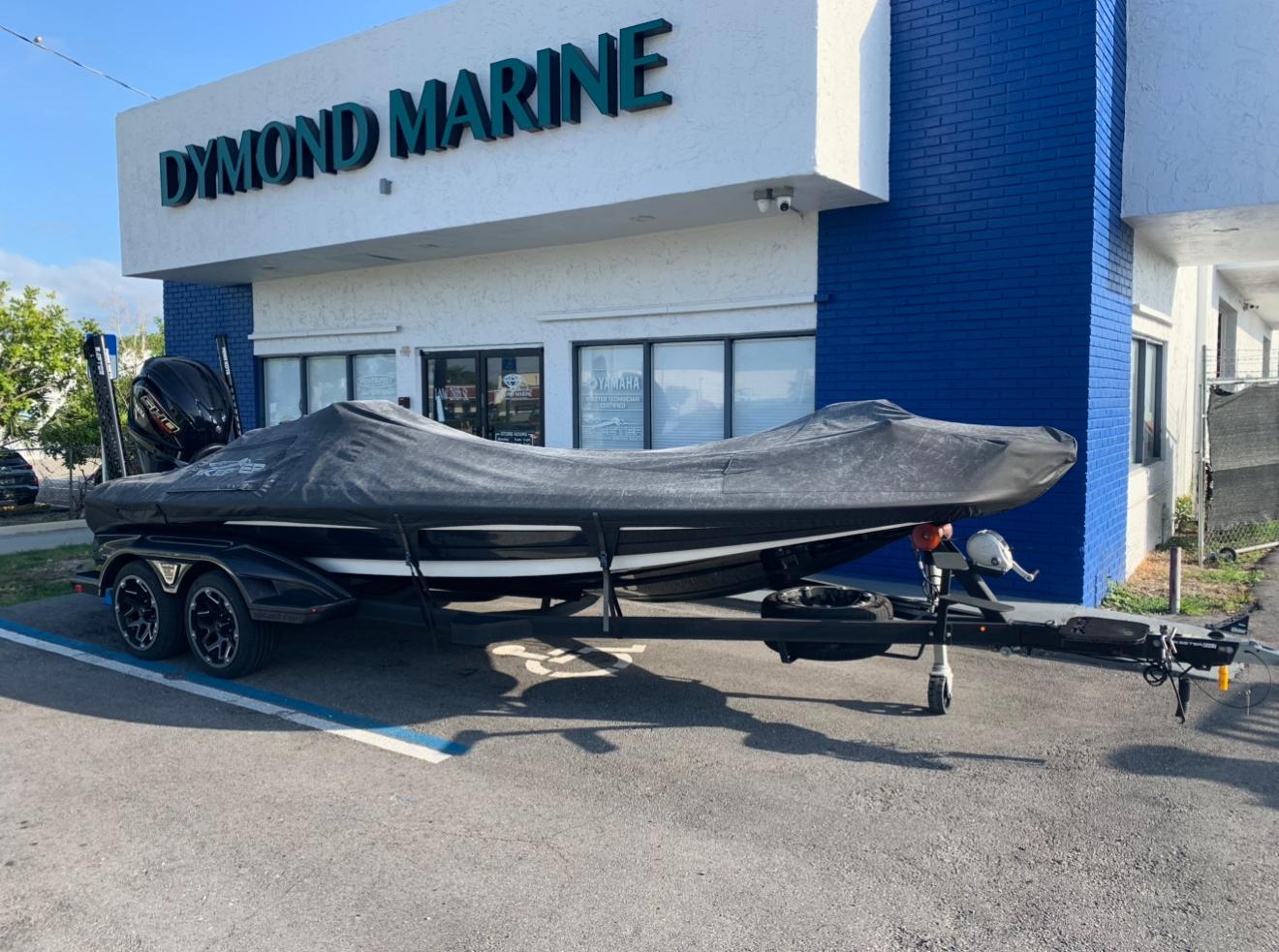 2022 Skeeter FXR 21 APEX boat covered, parked outside Dymond Marine.