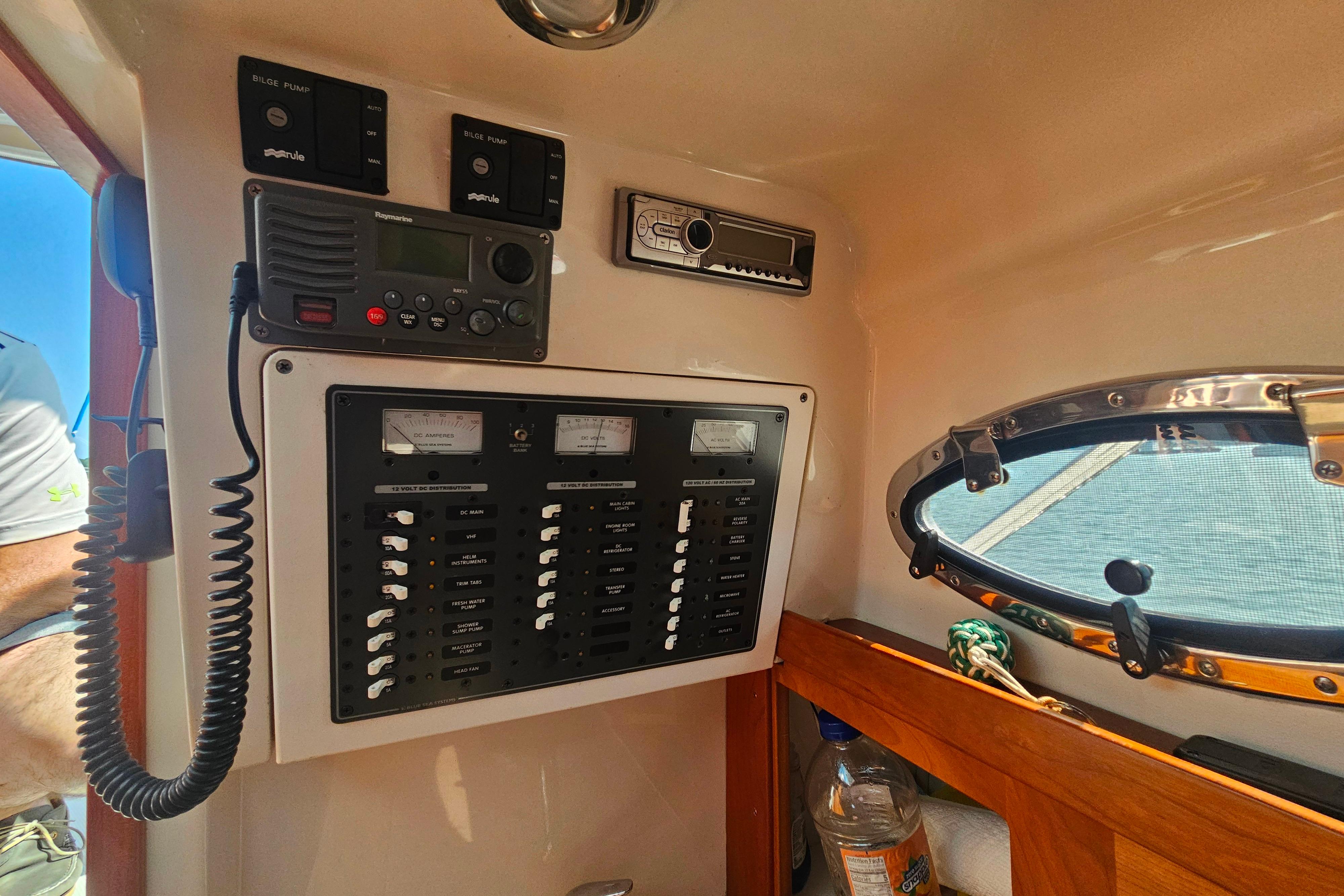 Control panel of a 2006 Back Cove 26 boat with radio and switches.