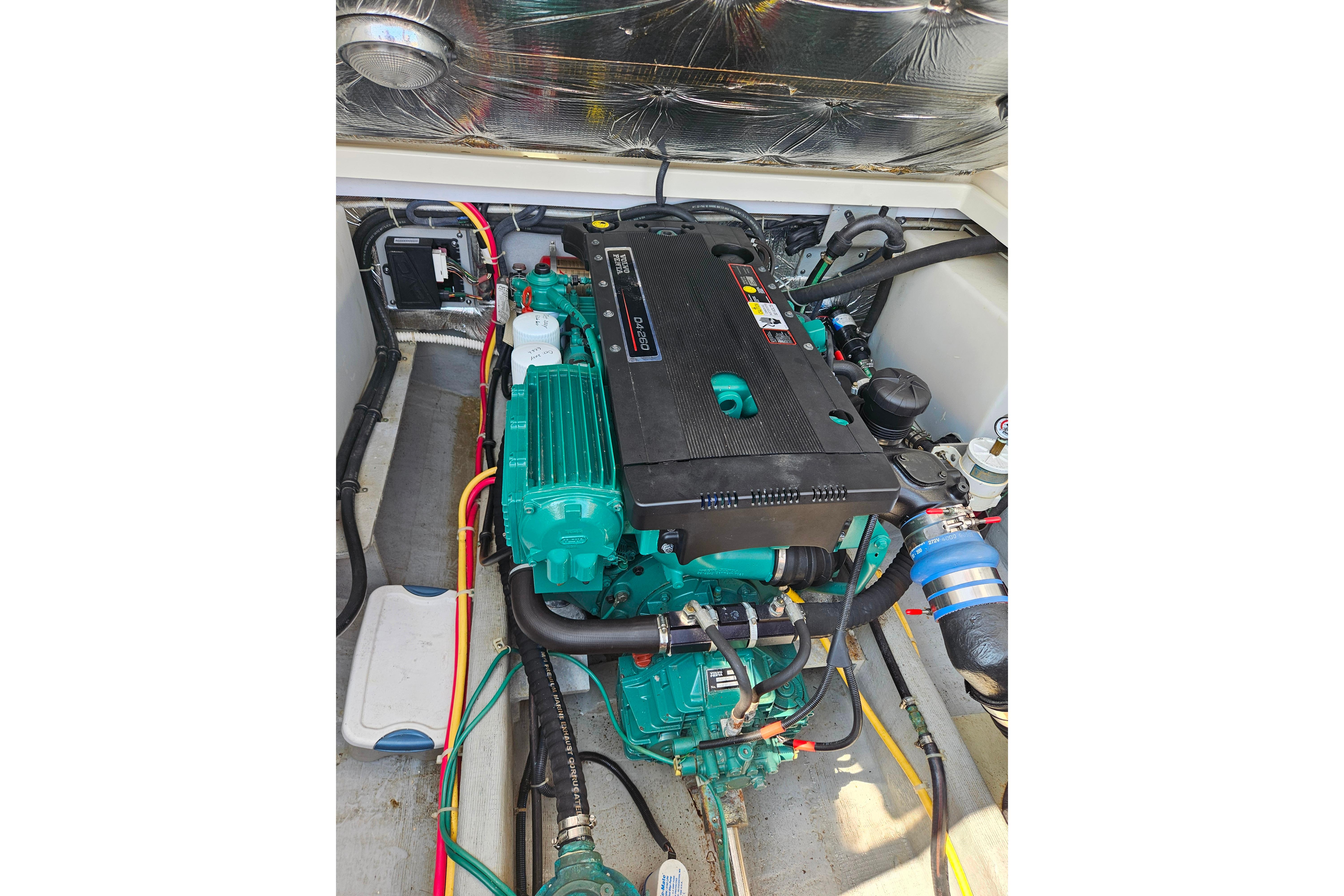 Engine compartment of a 2006 Back Cove 26 boat, showcasing detailed components.