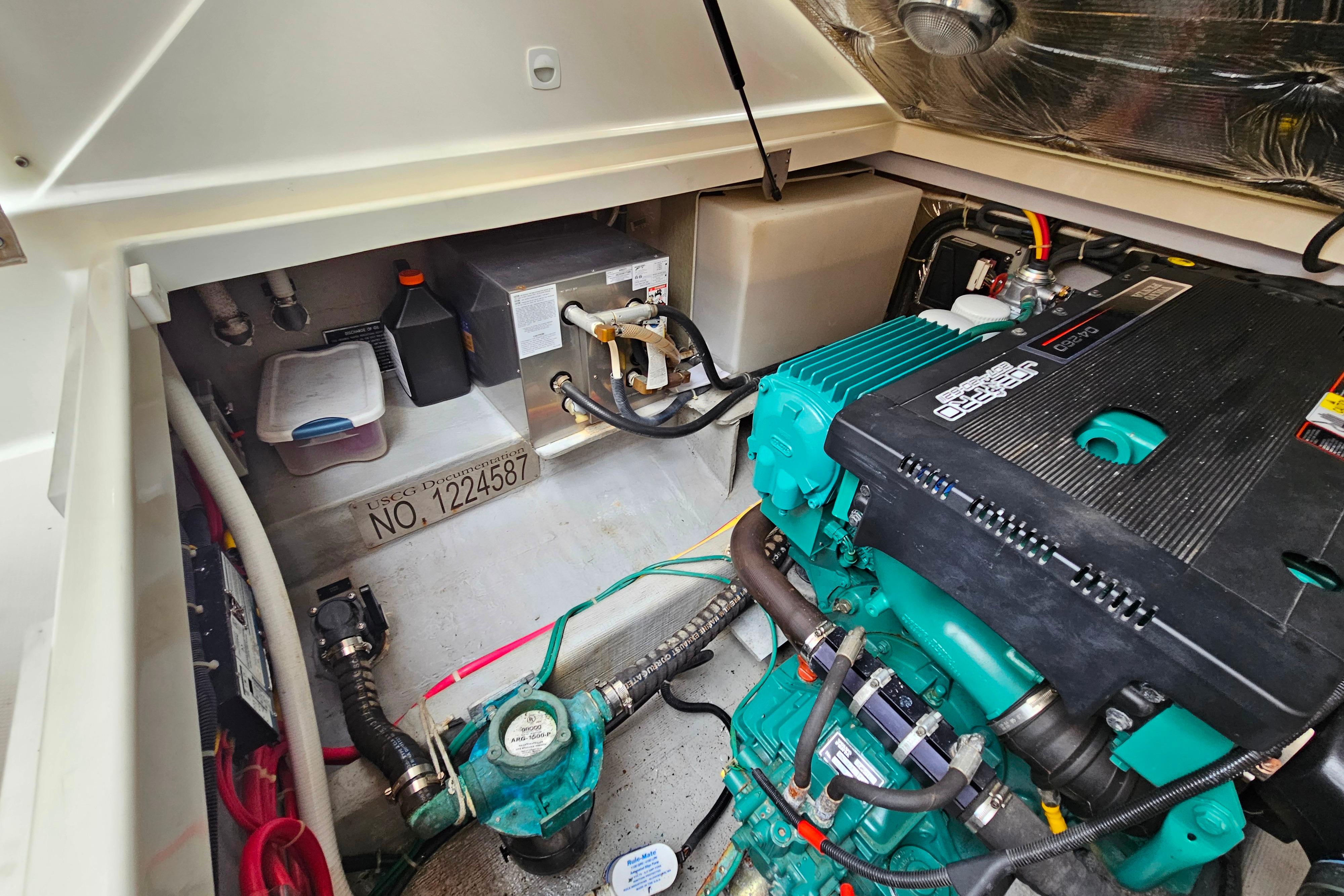 Engine compartment of a 2006 Back Cove 26 boat, featuring a well-maintained marine engine.