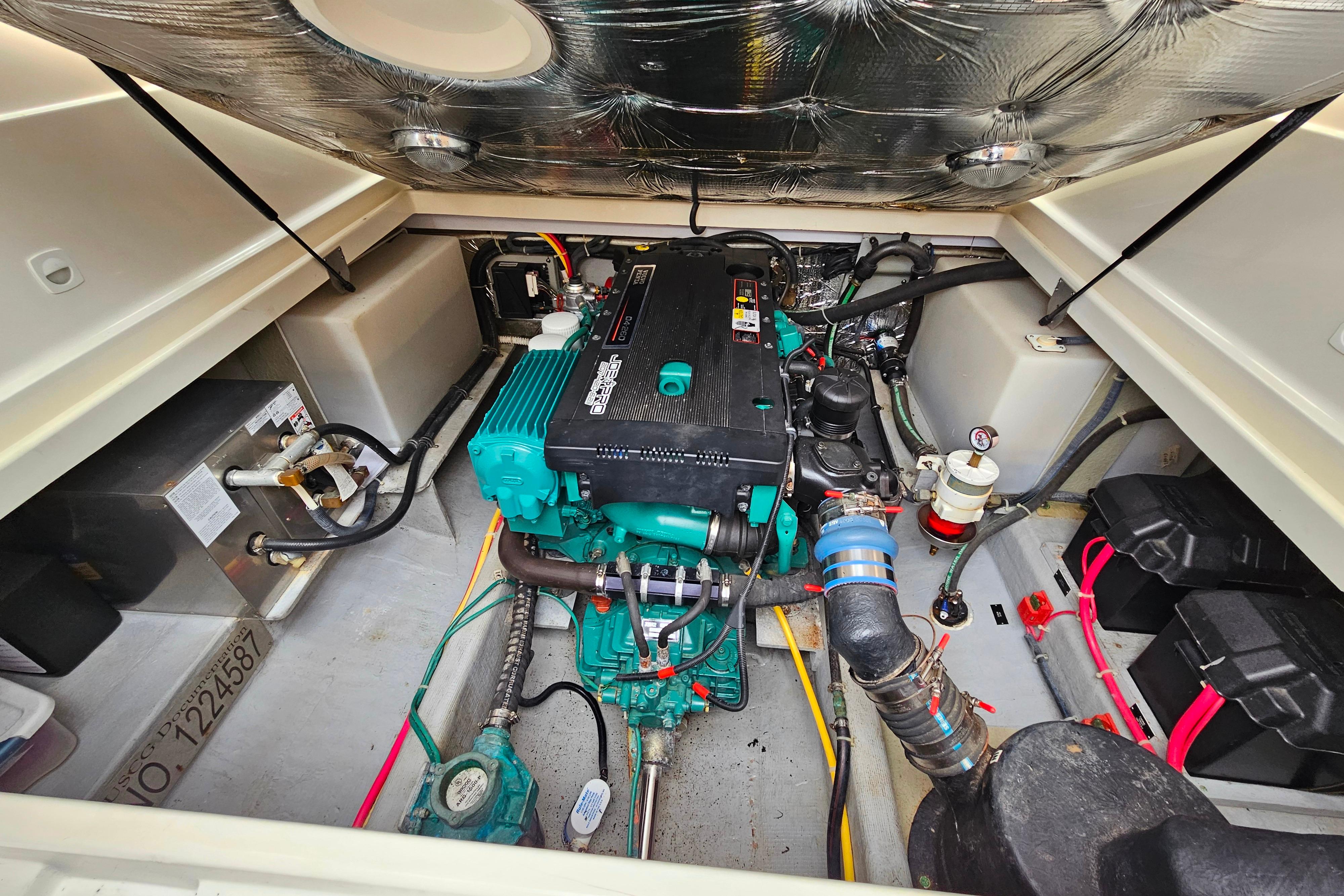 Engine compartment of a 2006 Back Cove 26 boat, showcasing detailed mechanical components.
