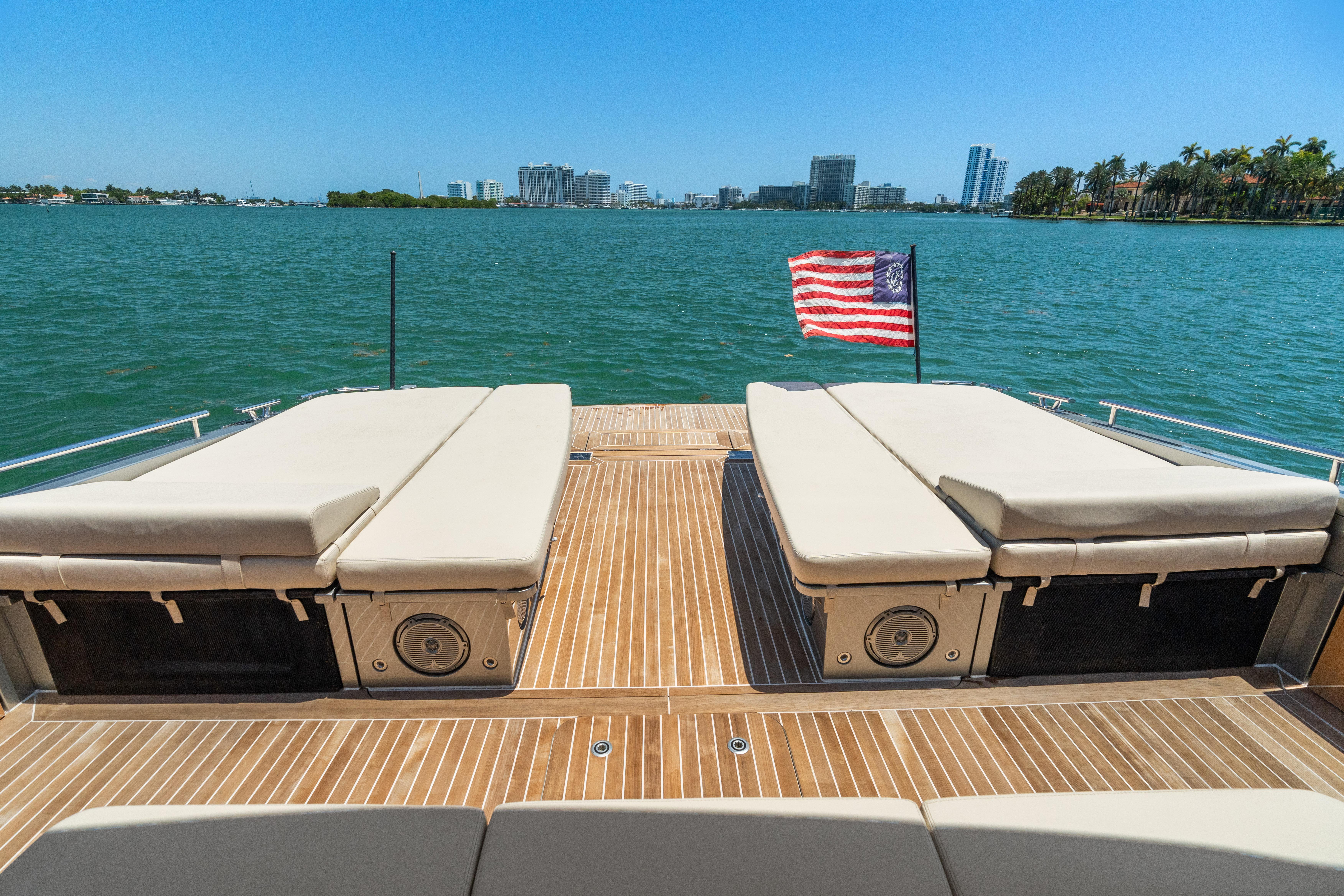 CNM-Continental 54 2019-YANINA FL-US-Luxurious 2019 CNM Continental 54T yacht deck with sun loungers and American flag, ocean view.-9803754 | Thumbnail