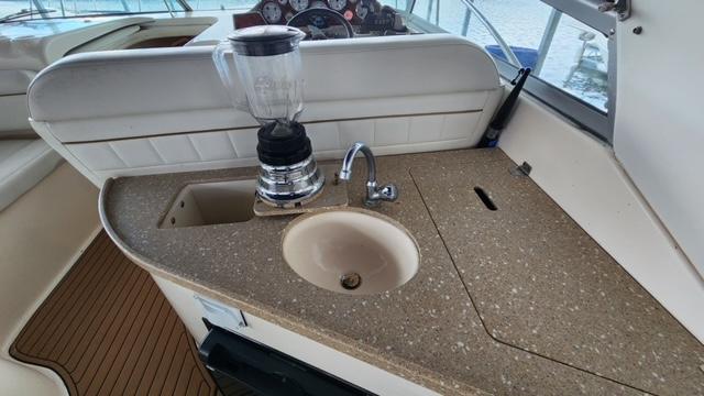 2005 Rinker Fiesta Vee 342 boat kitchenette with sink and blender.
