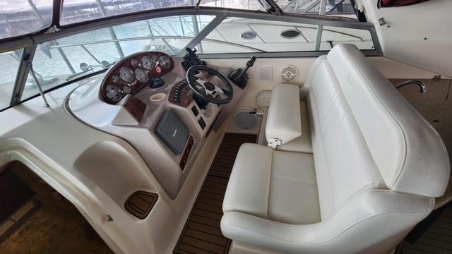 2005 Rinker Fiesta Vee 342 helm with white seating and control panel.