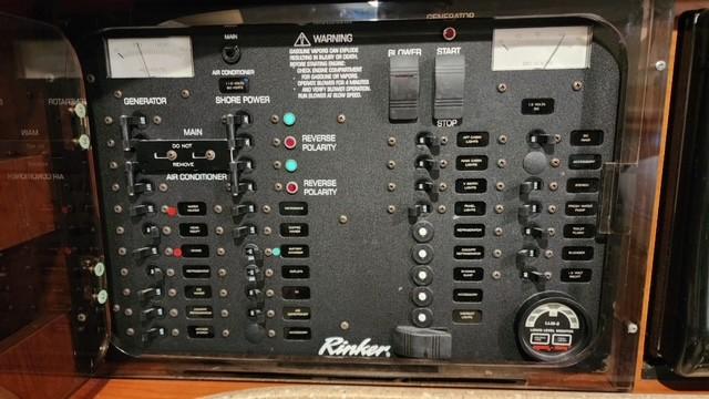 Control panel of 2005 Rinker Fiesta Vee 342 boat with various switches and indicators.
