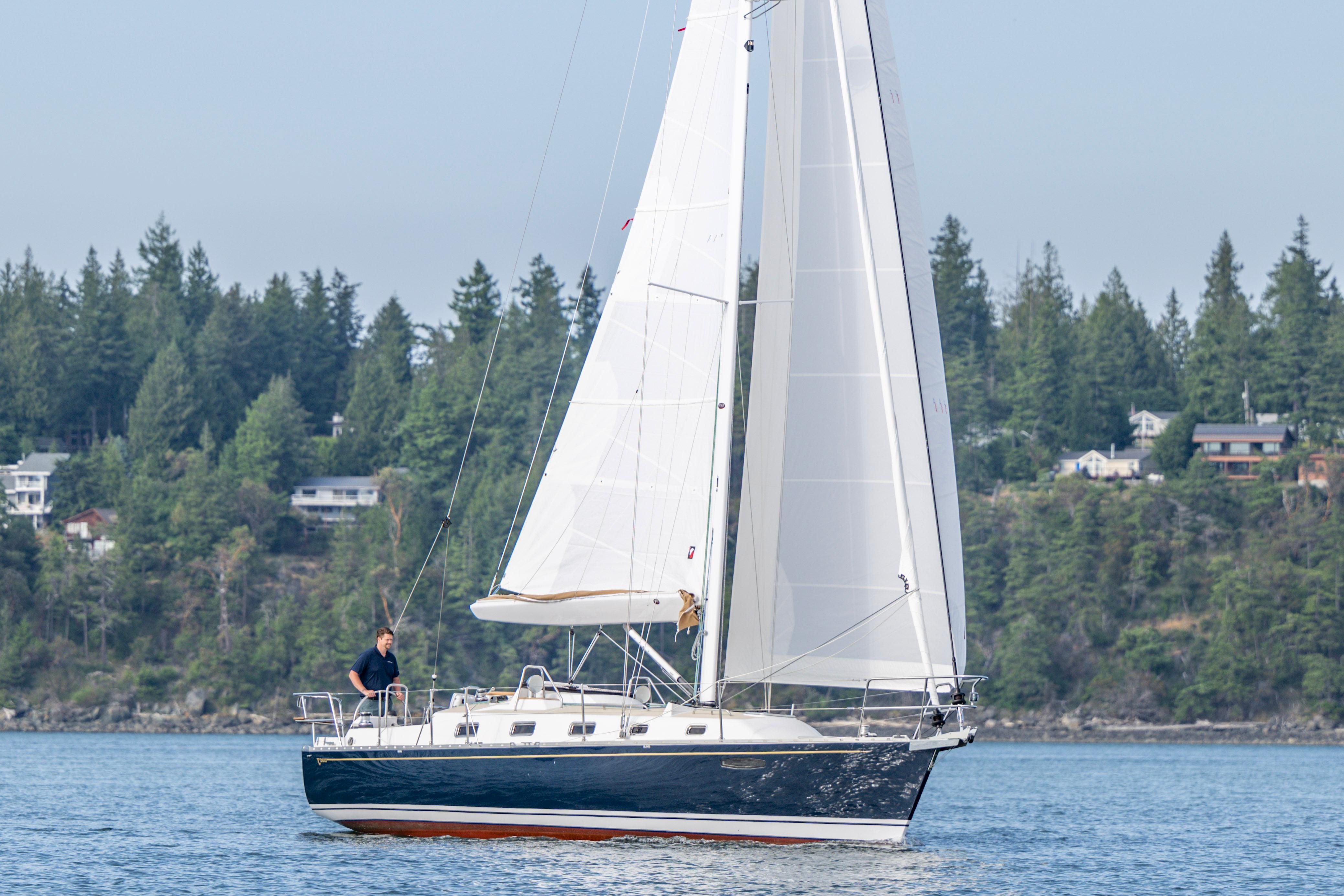 Tartan-365 2023-SEA #5 IN STOCK WA-US-Sailing yacht Tartan 365, 2023 model, cruising on a serene lake with forested backdrop.-9568831