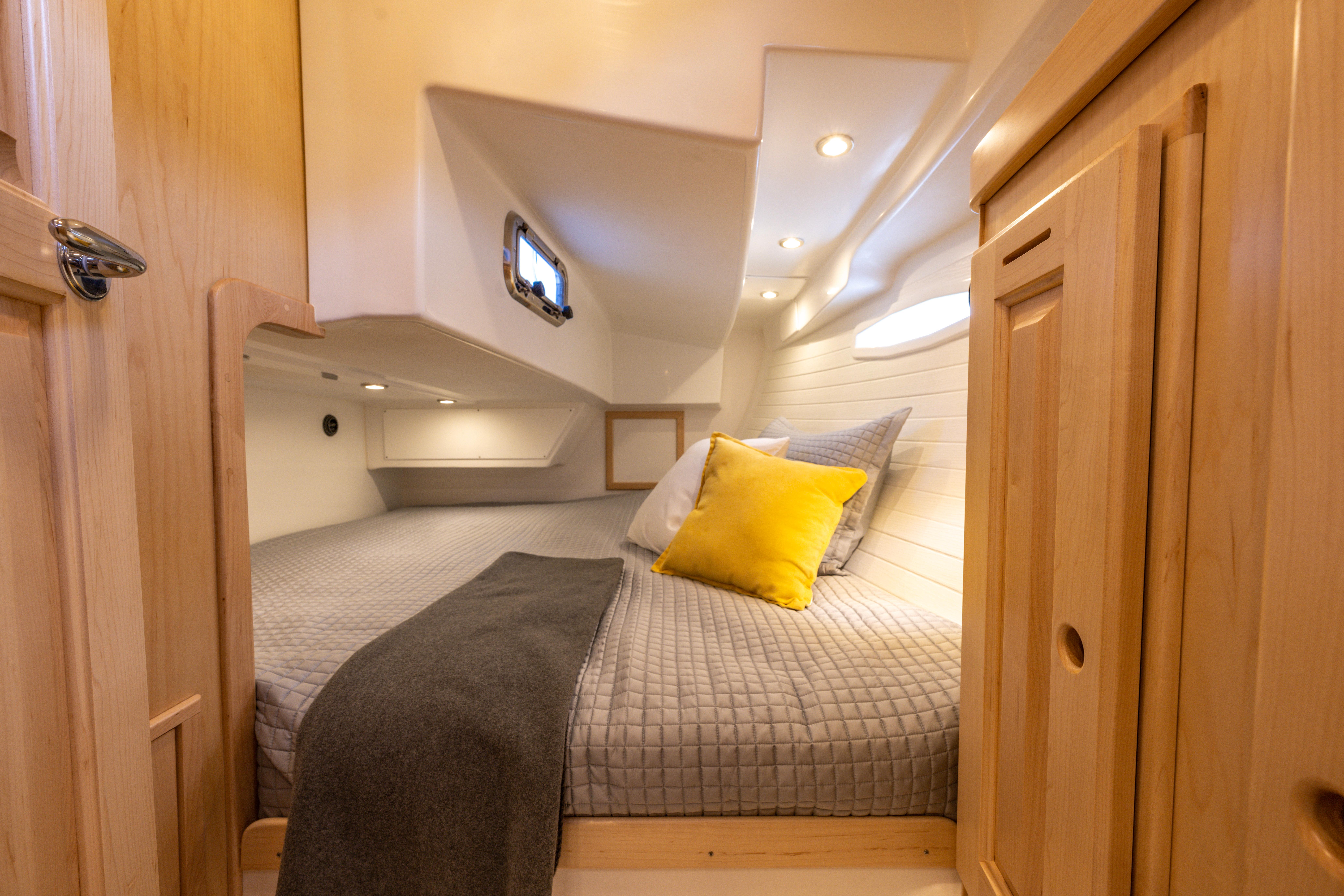 Tartan-365 2023-SEA #5 IN STOCK WA-US-Cozy cabin interior of 2023 Tartan 365 yacht with modern bedding and wood finish.-9568831 | Thumbnail