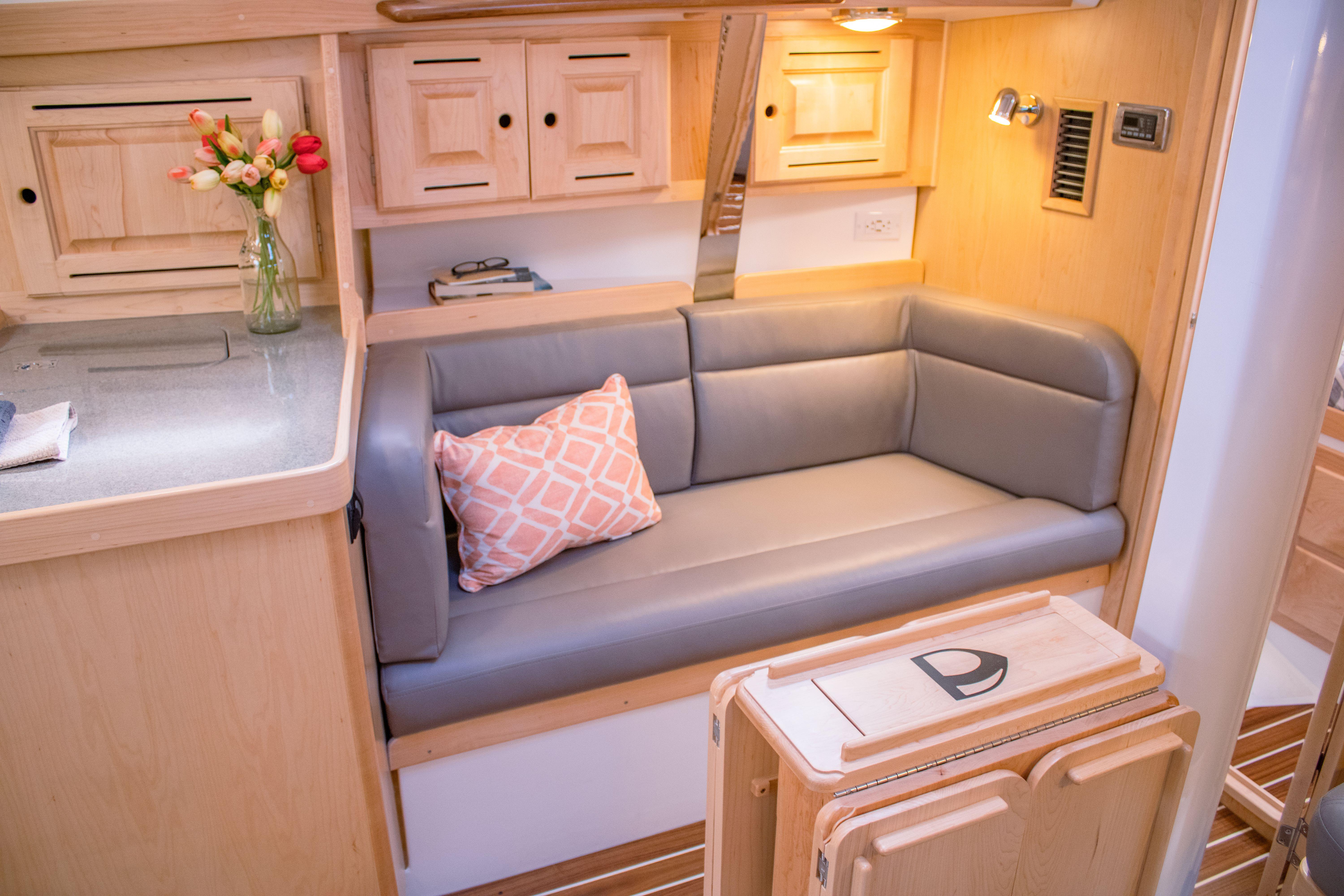 Tartan-365 2023-SEA #5 IN STOCK WA-US-Cozy interior of 2023 Tartan 365 yacht with cushioned seating and wooden cabinetry.-9568831 | Thumbnail
