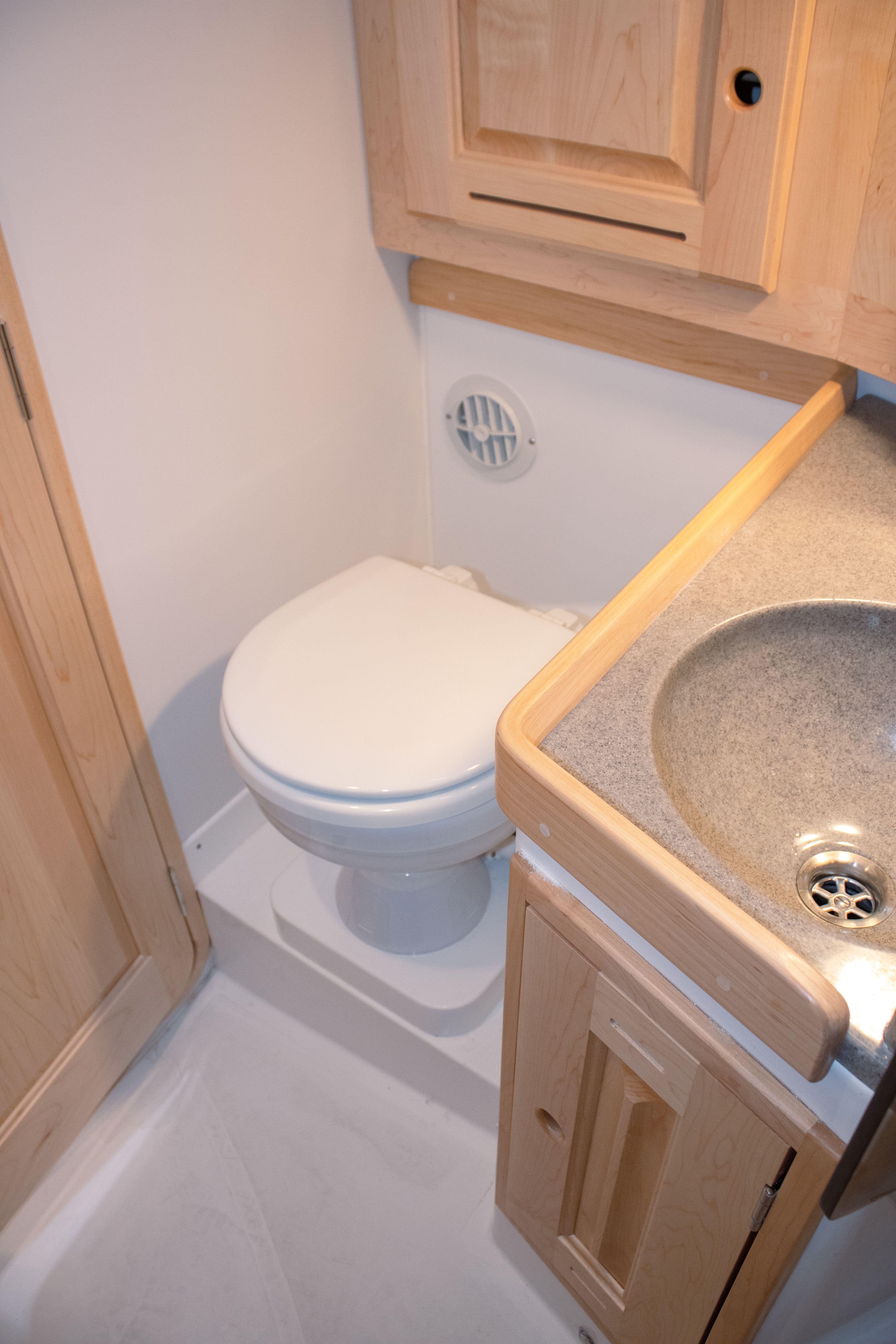Tartan-365 2023-SEA #5 IN STOCK WA-US-Compact bathroom in 2023 Tartan 365 yacht with toilet and sink.-9568831 | Thumbnail