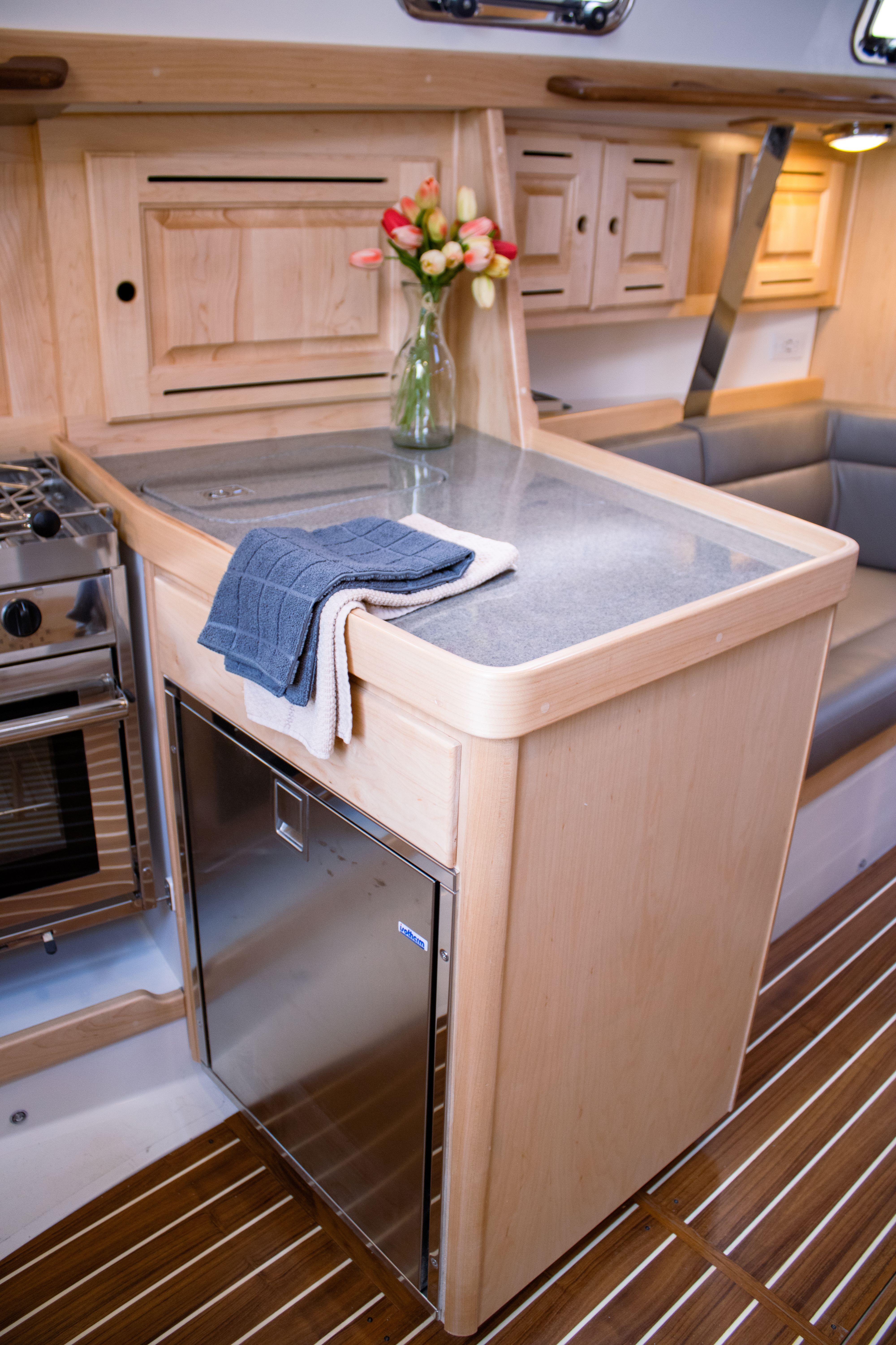 Tartan-365 2023-SEA #5 IN STOCK WA-US-Modern Tartan 365 yacht interior with sleek kitchen and elegant wood finish, 2023 model.-9568831 | Thumbnail