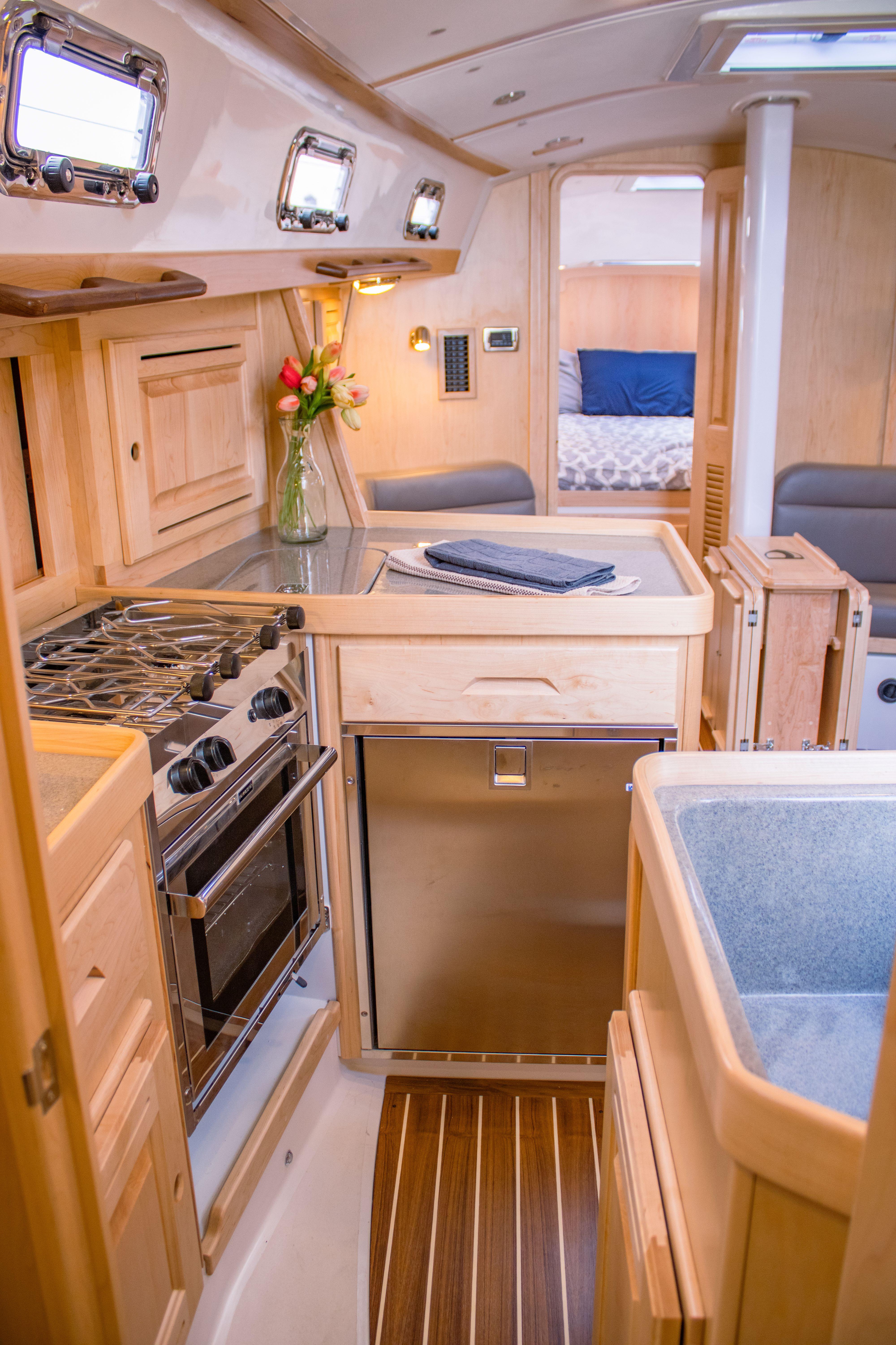 Tartan-365 2023-SEA #5 IN STOCK WA-US-Modern Tartan 365 yacht interior with kitchen, wood finish, and cozy cabin, 2023 model.-9568831 | Thumbnail