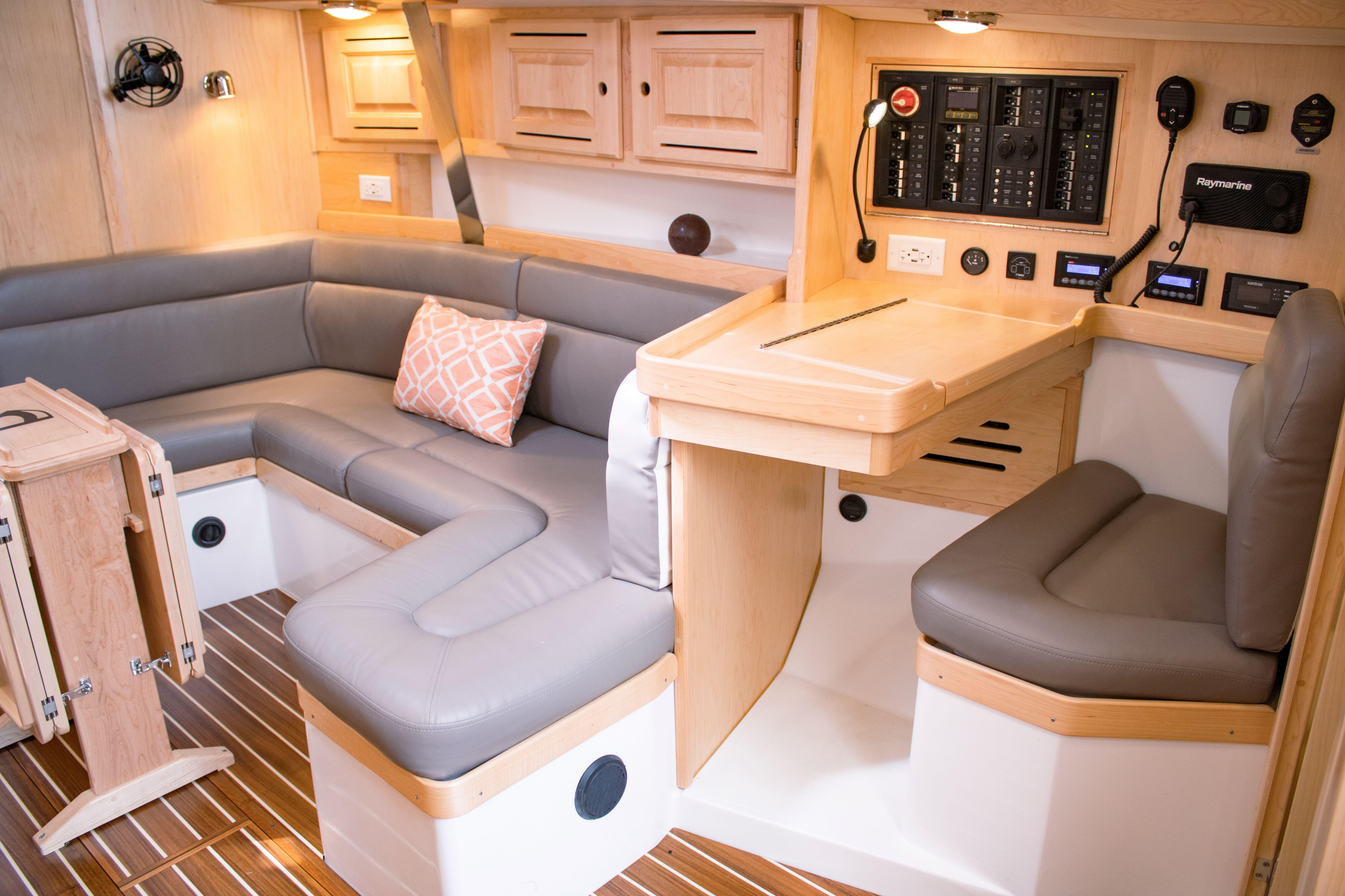 Tartan-365 2023-SEA #5 IN STOCK WA-US-Luxurious interior of 2023 Tartan 365 yacht with cozy seating and navigation station.-9568831 | Thumbnail